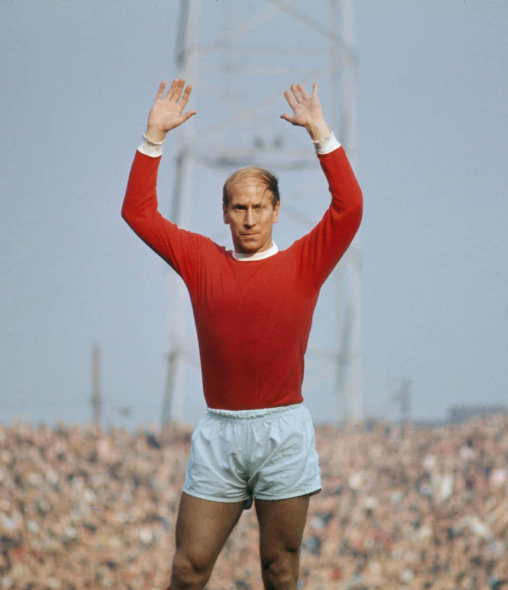 Bobby Charlton, red jersey, roaring crowd, SD Phone Wallpaper