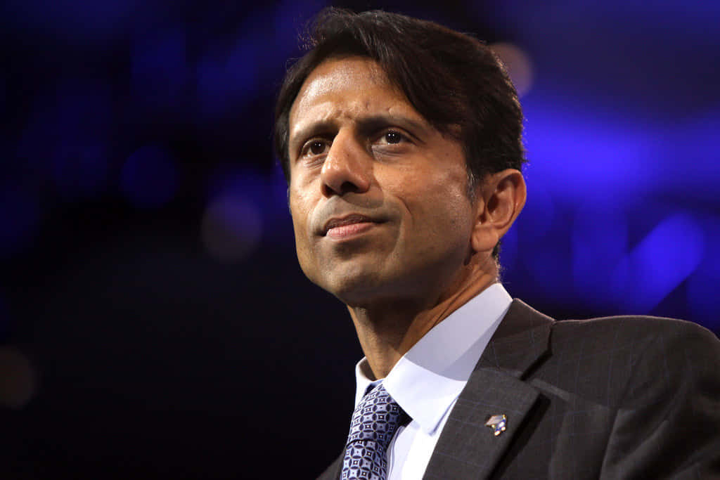 Bobby Jindal, suit and tie, blurred blue background, SD Desktop Wallpaper