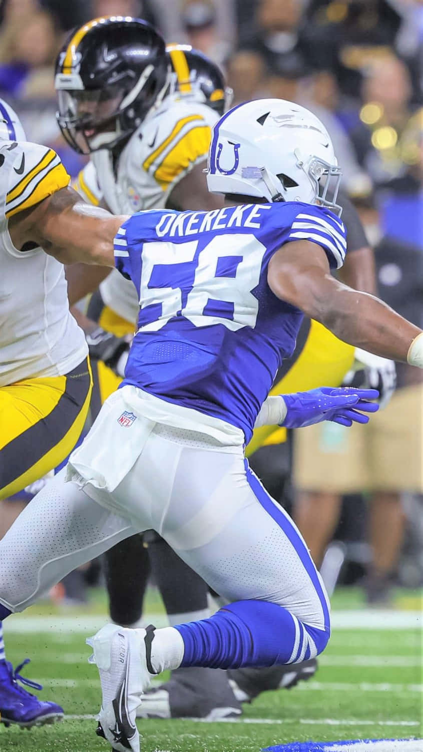 Bobby Okereke, blue and white uniform, green field, HD Phone Wallpaper