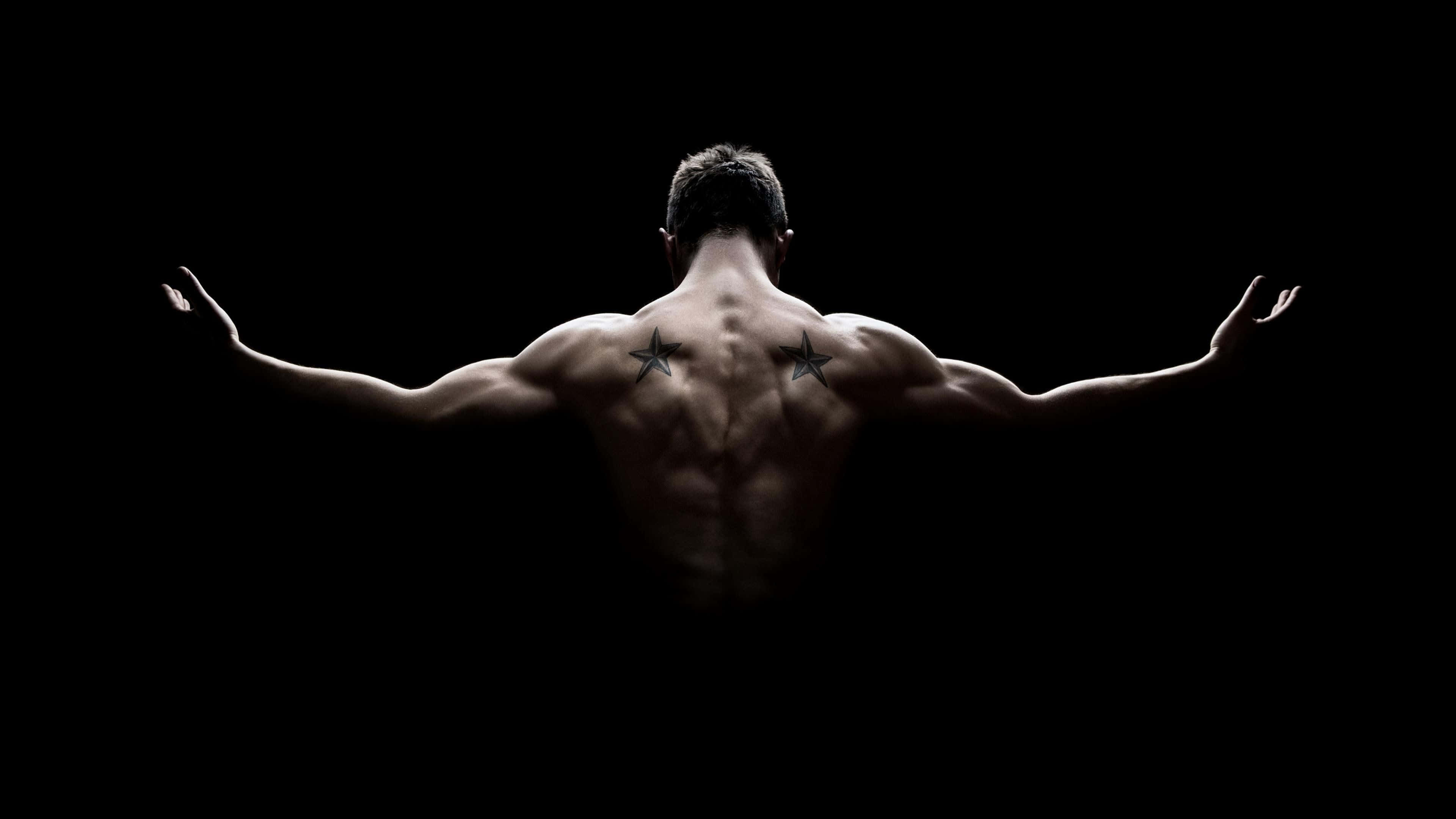 muscular back, arms outstretched, black background, 4K Desktop Wallpaper