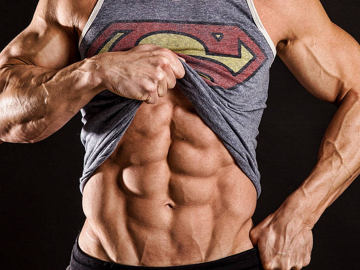 Superman tank top, defined abs, black background, SD Desktop Wallpaper