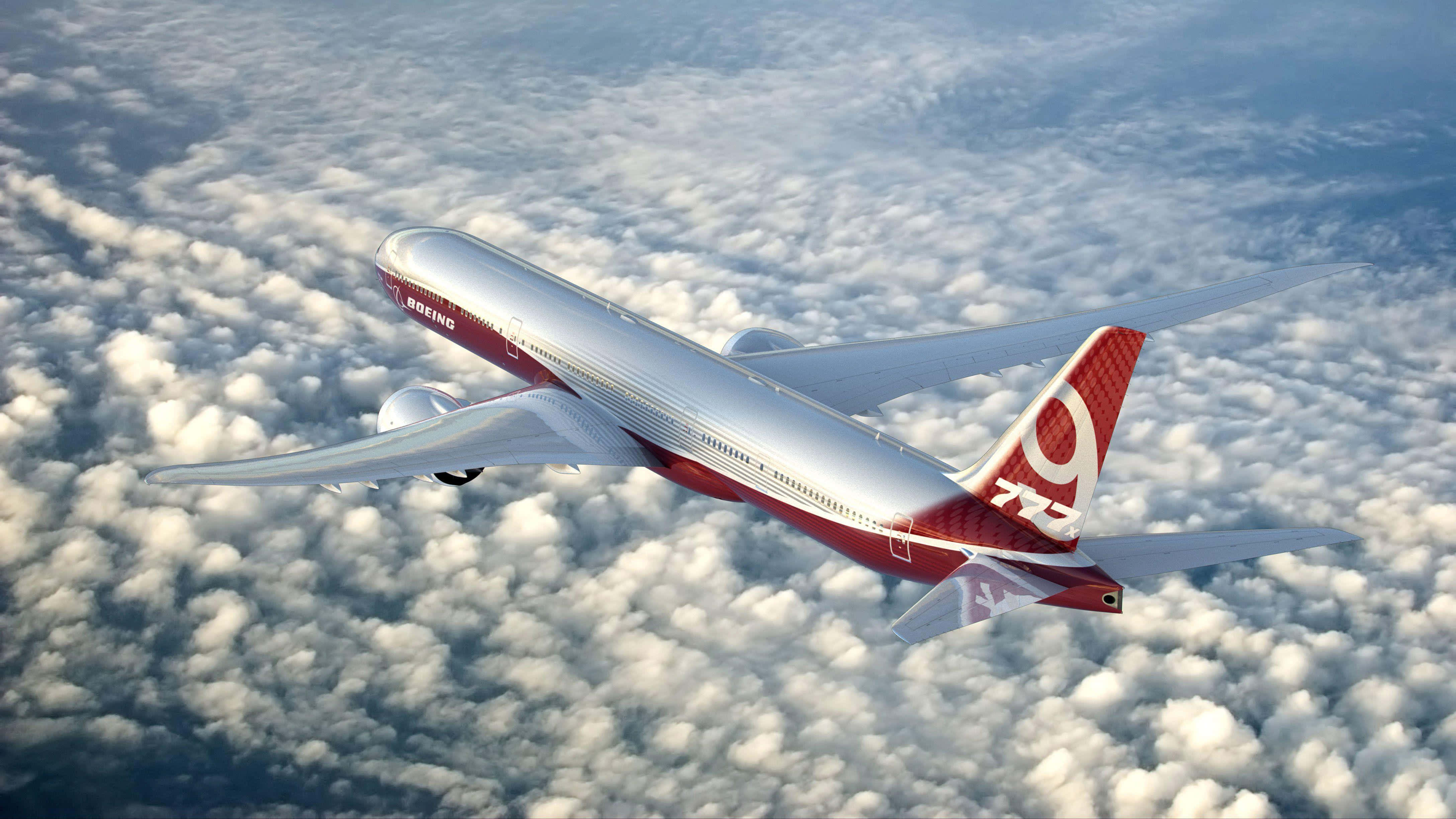 Boeing 777, red and silver, fluffy white clouds, 4K Desktop Wallpaper