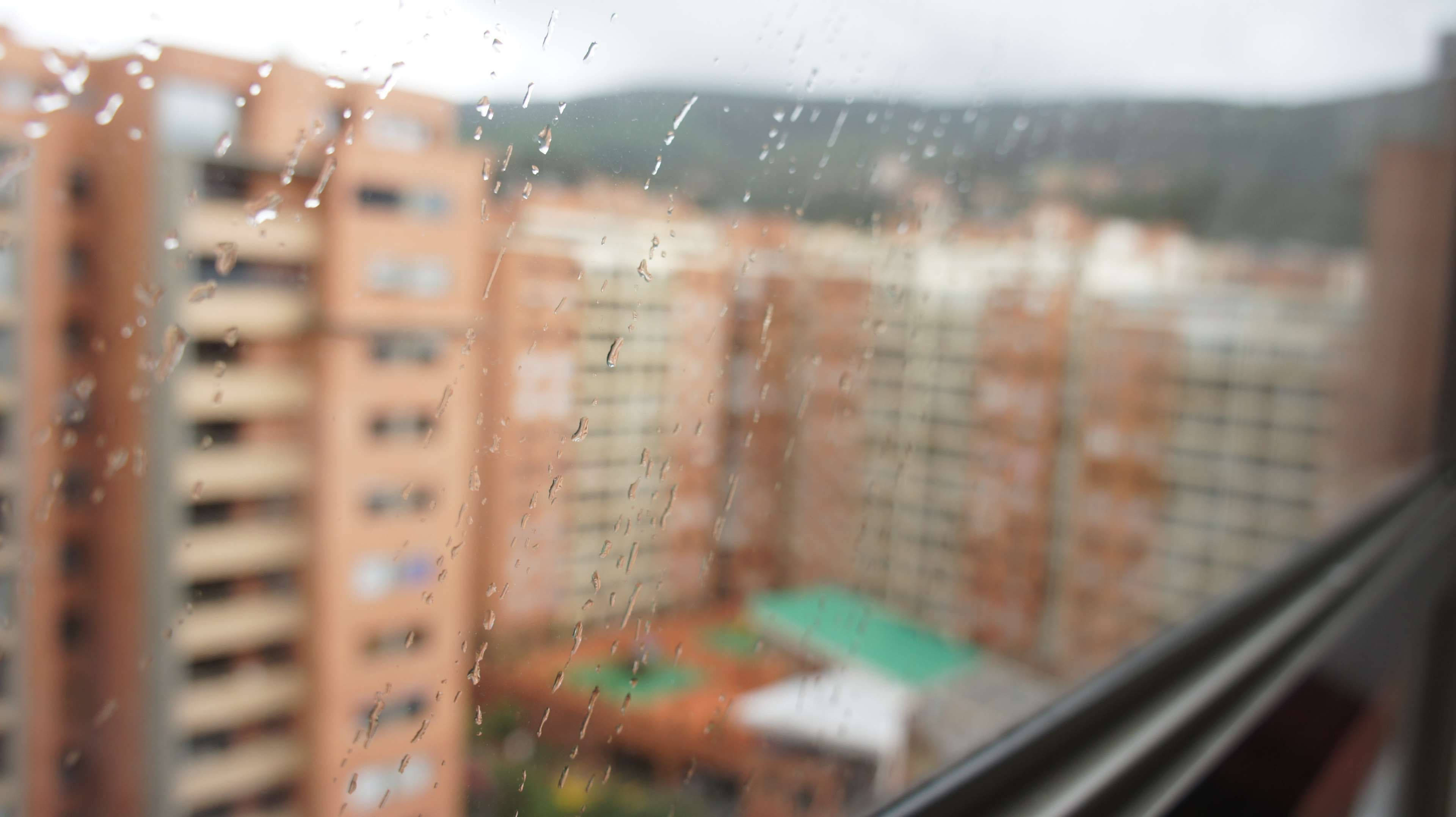 Bogota, orange apartment buildings, distant green hills, 4K Desktop Wallpaper