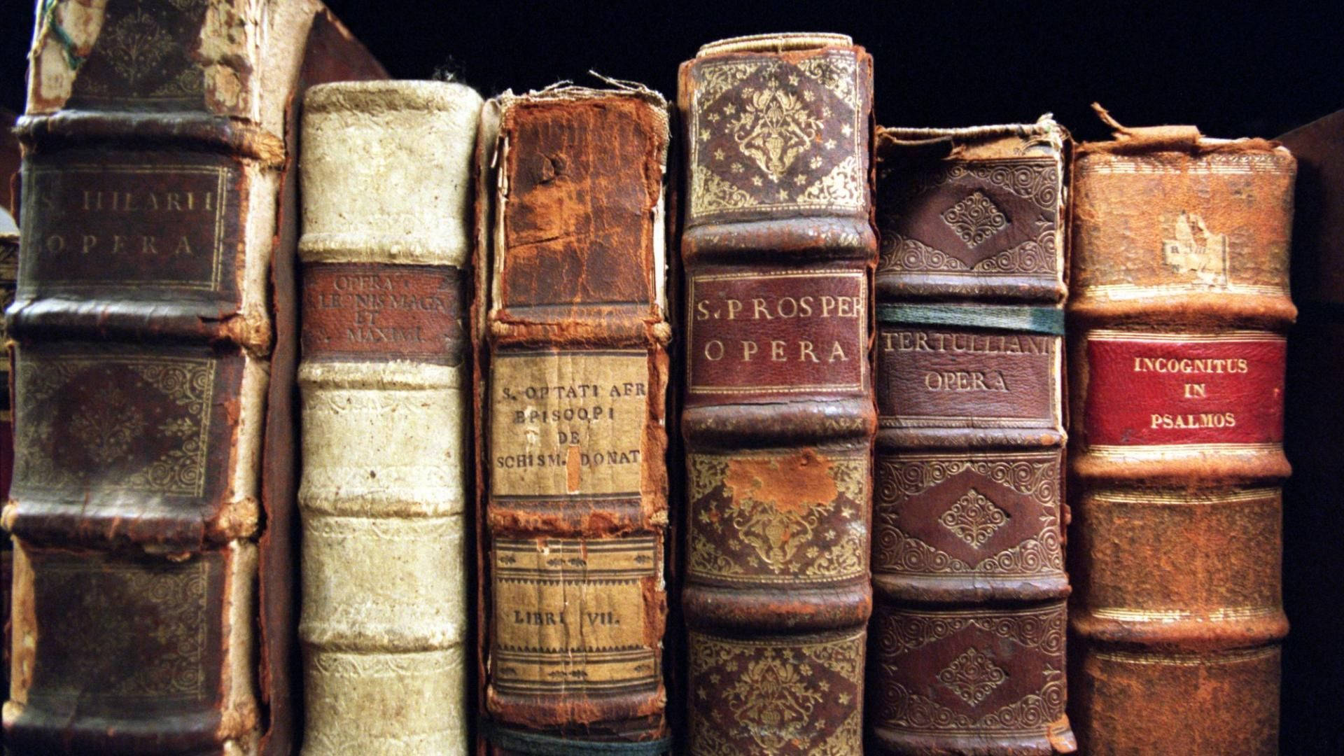 leather-bound books, faded gold lettering, cracked spines, Full HD Desktop Wallpaper