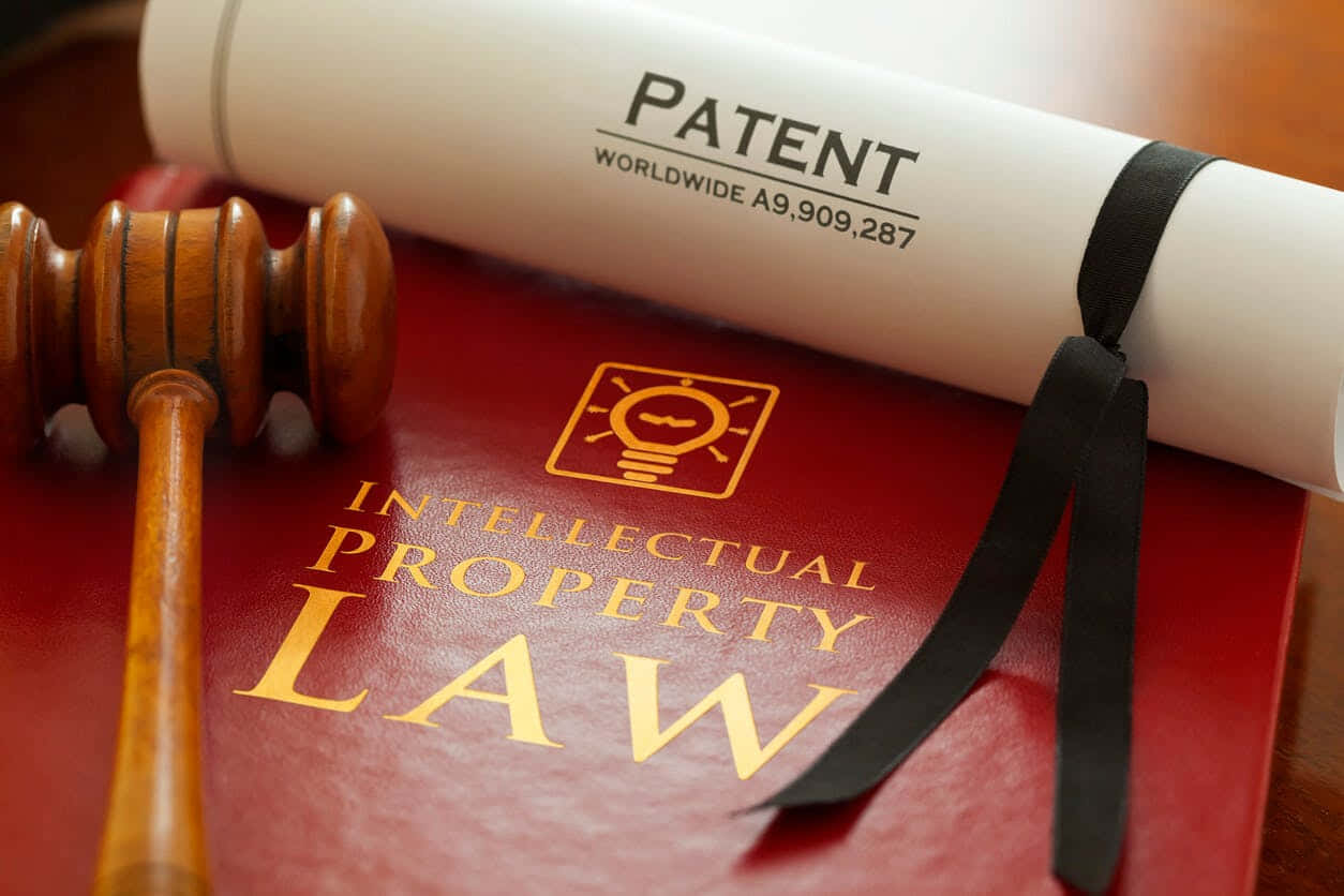 wooden gavel, rolled patent document, red intellectual property law book, SD Desktop Wallpaper