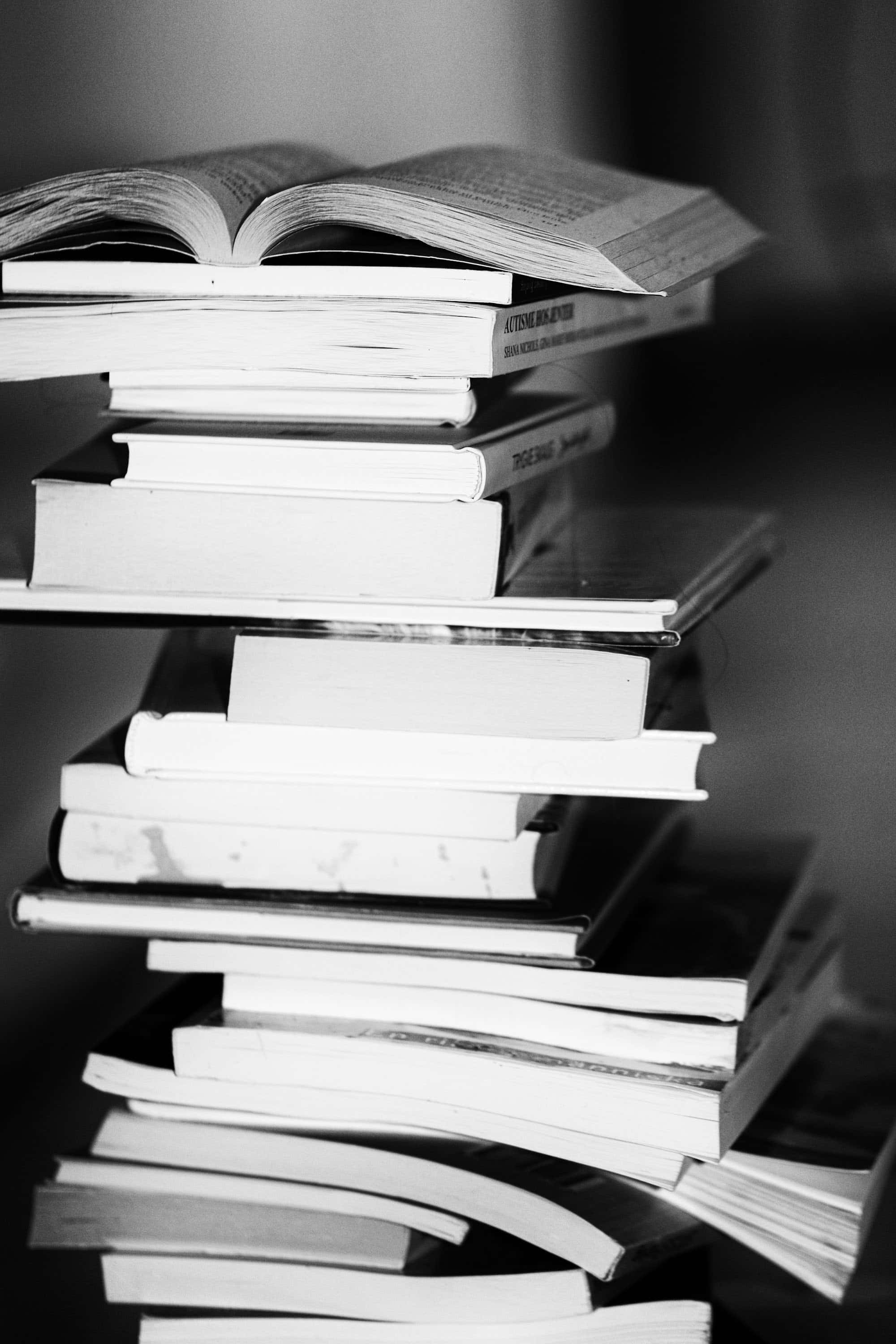 published books, educated authors, tall precarious stack, 2K Phone Wallpaper