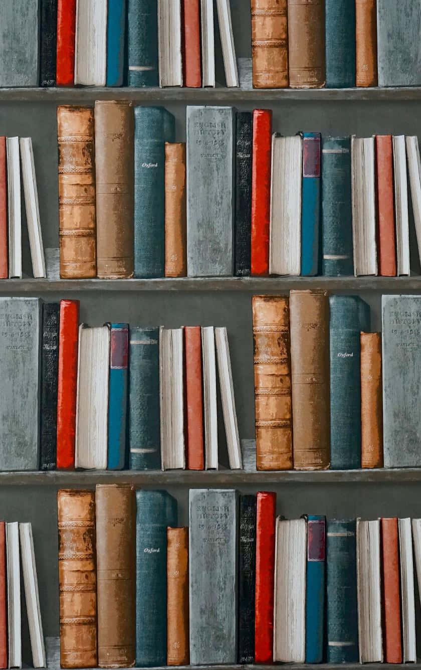 vintage books, worn leather and cloth spines, earthy tones, HD Phone Wallpaper