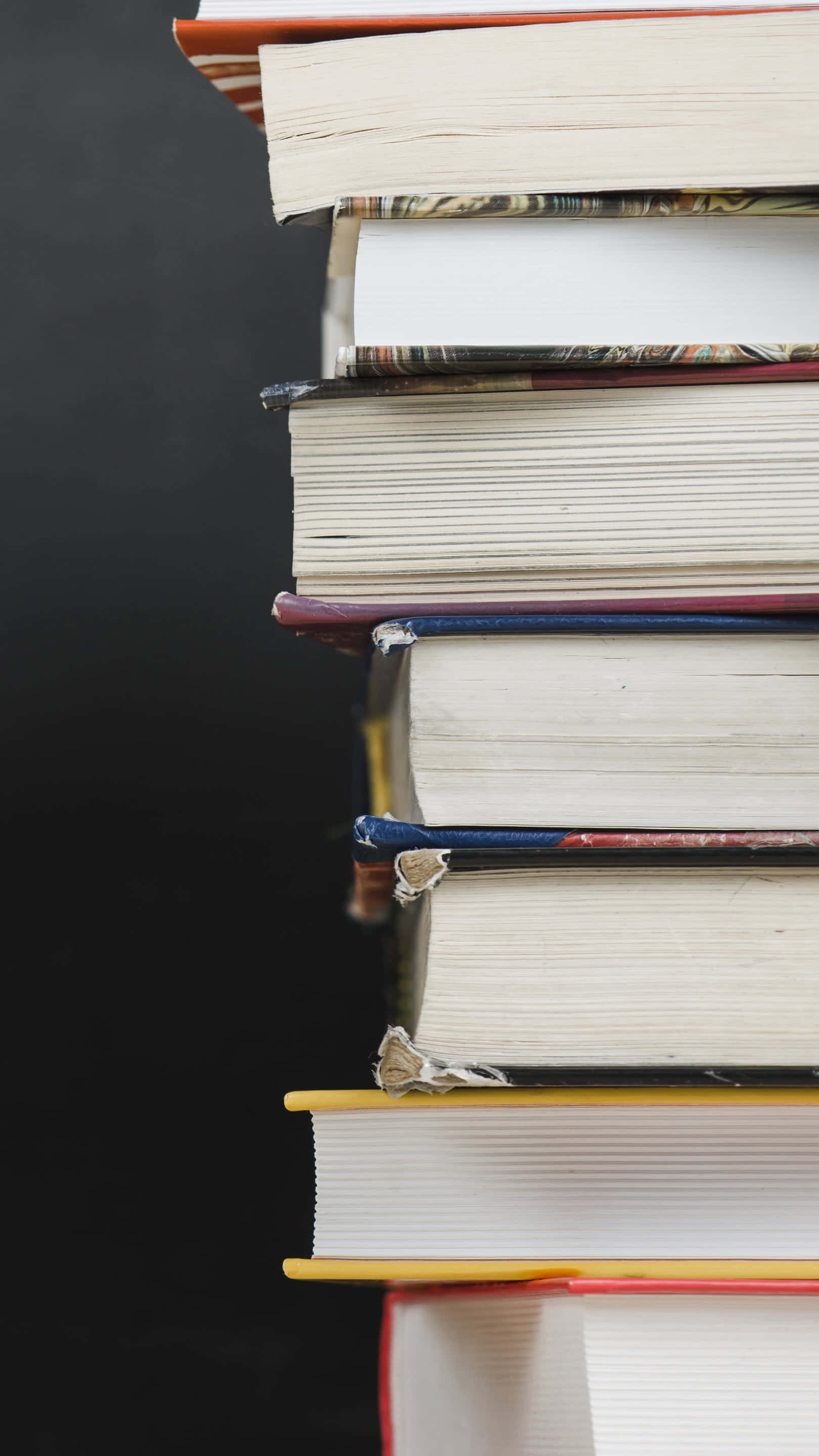 books, black background, colorful spines, 2K Phone Wallpaper