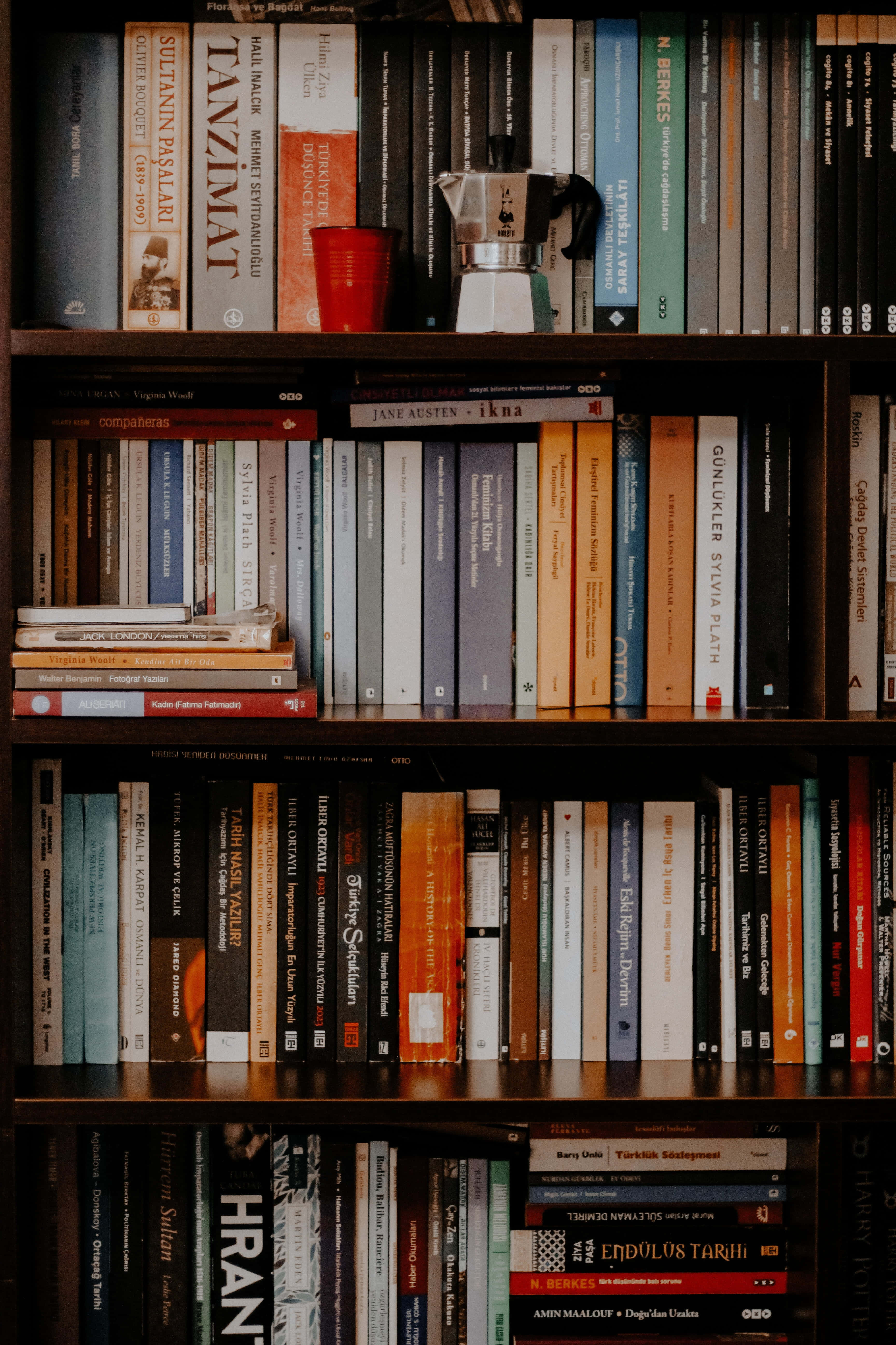 bookshelf, colorful books, red cup, 5K Phone Wallpaper