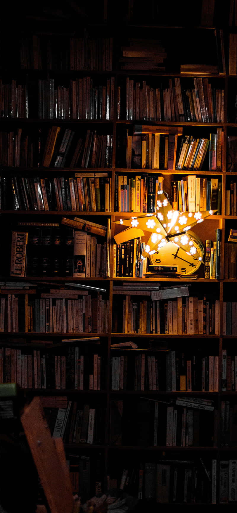 star-shaped lamp, clock, towering bookshelves, HD Phone Wallpaper