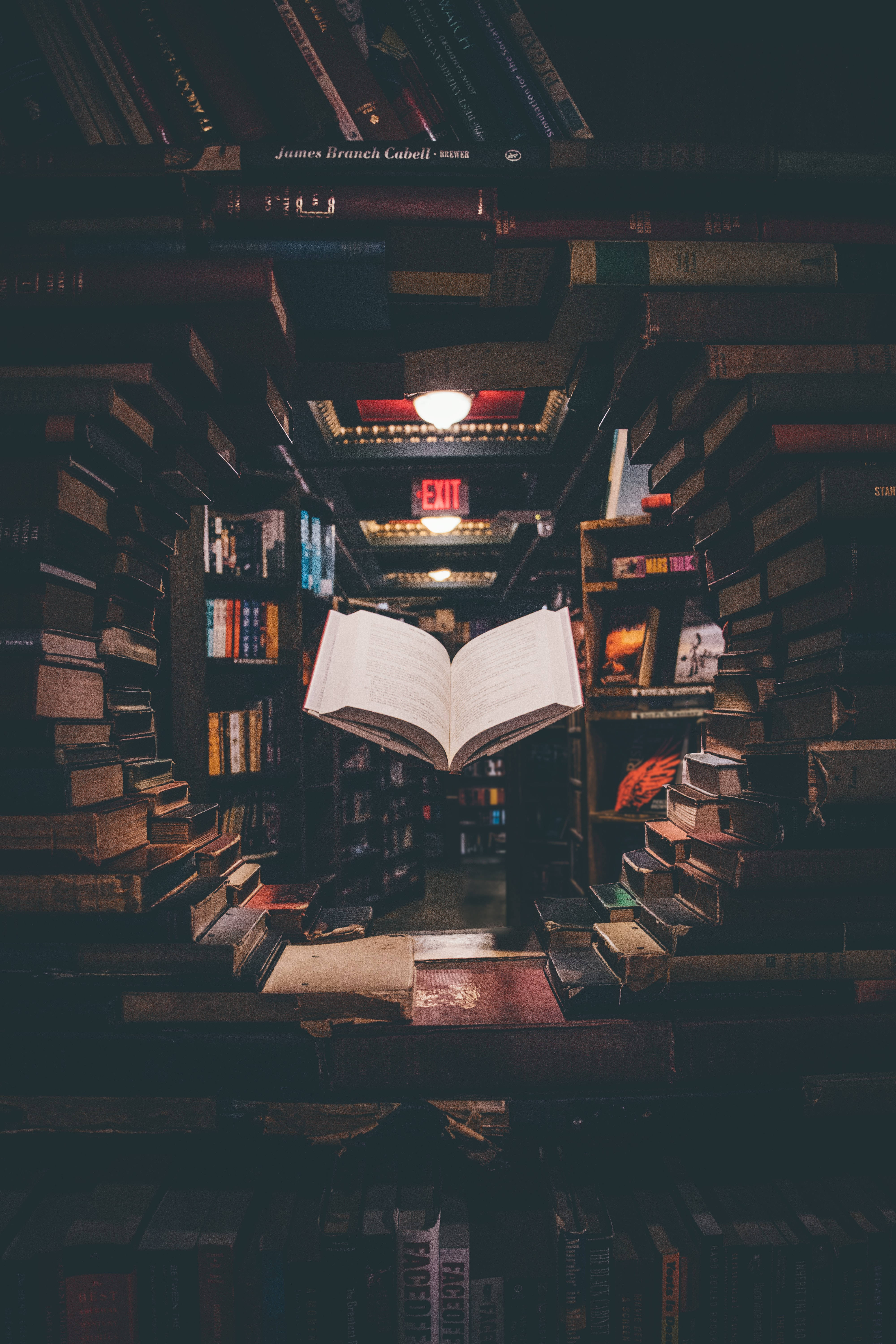 library shelf, open book, dimly lit bookstore aisle, 5K Phone Wallpaper