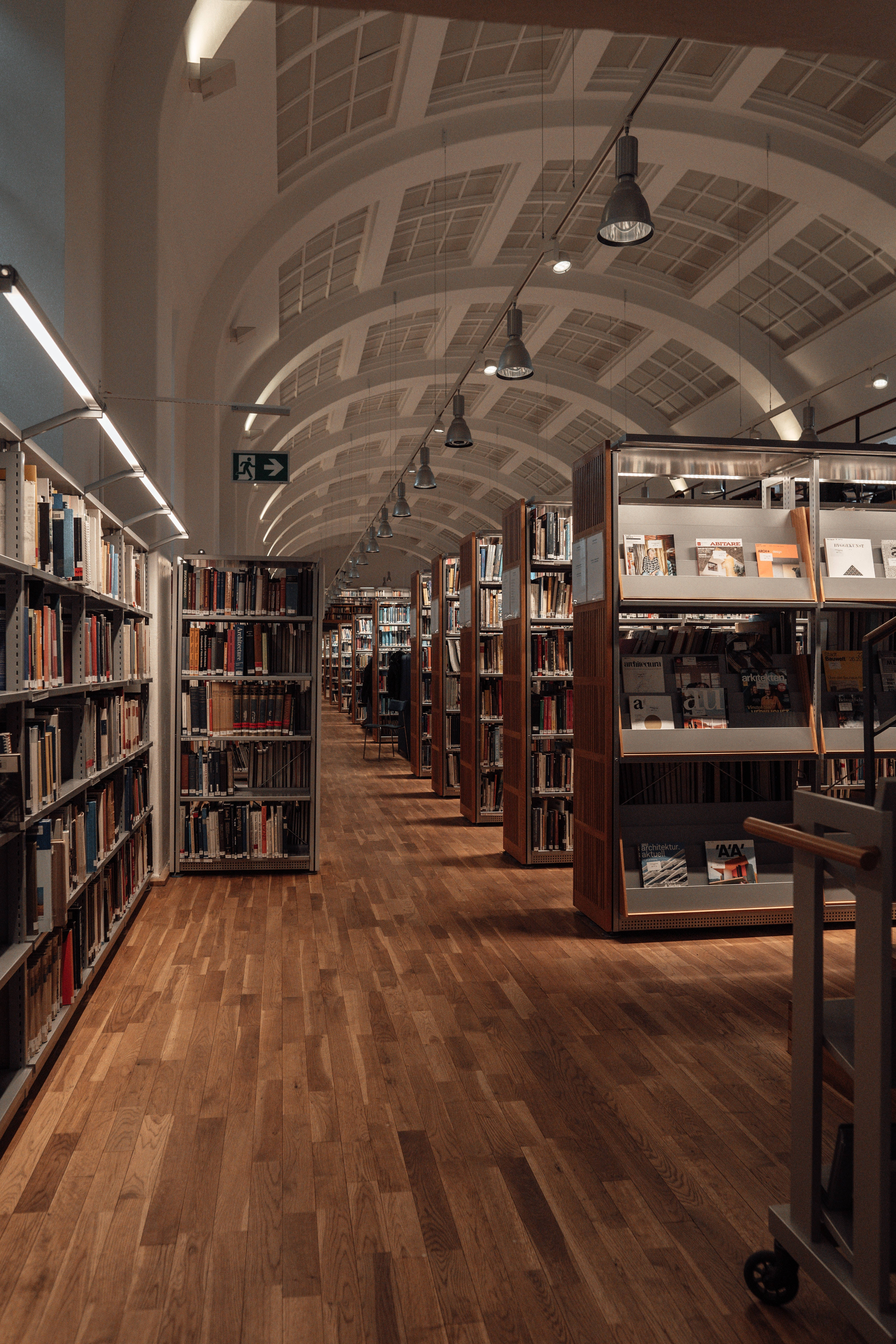 public library, wooden-floored library aisle, tall bookshelves, 5K Phone Wallpaper