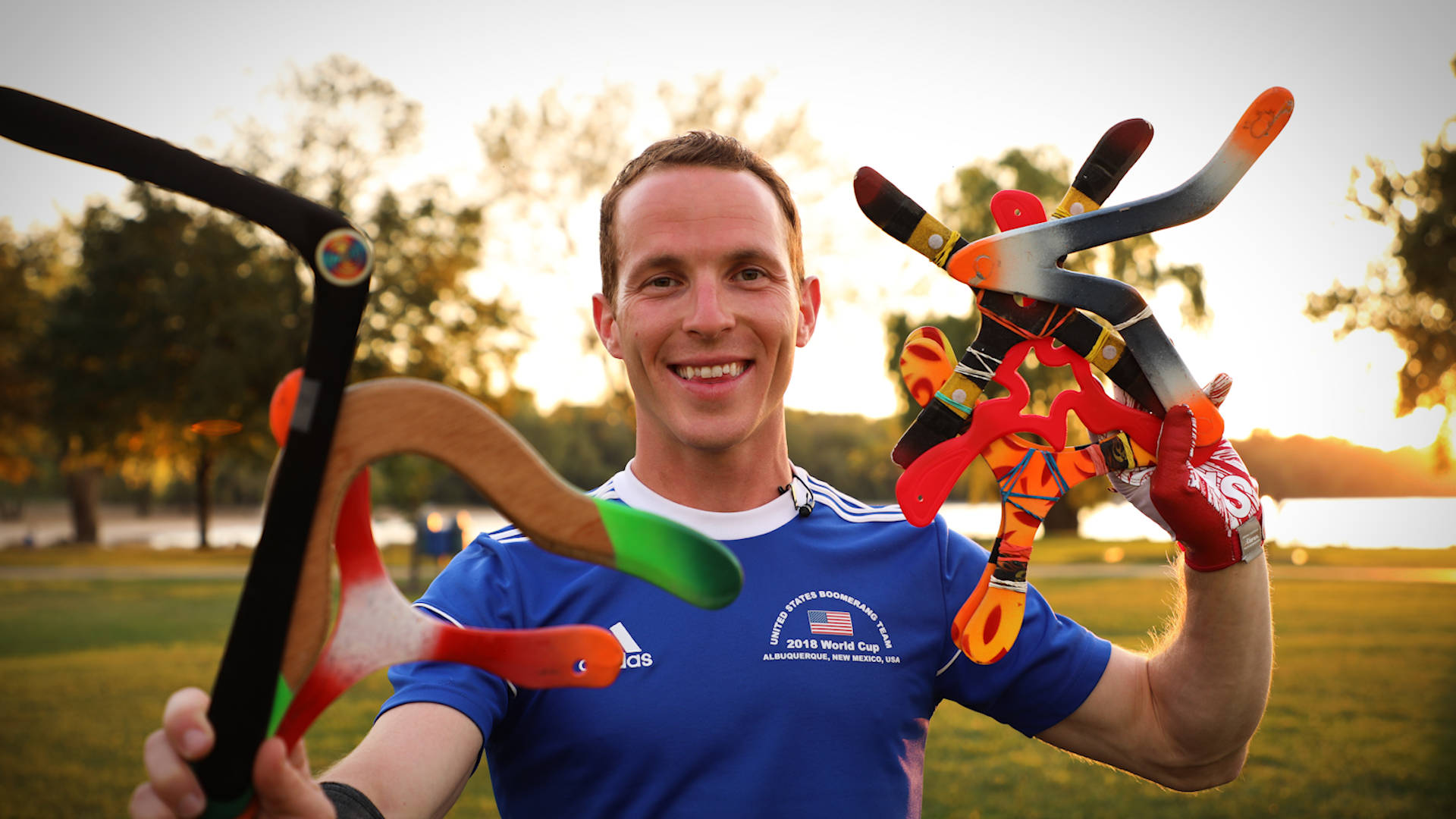 man, blue sports jersey, colorful boomerangs, Full HD Desktop Wallpaper