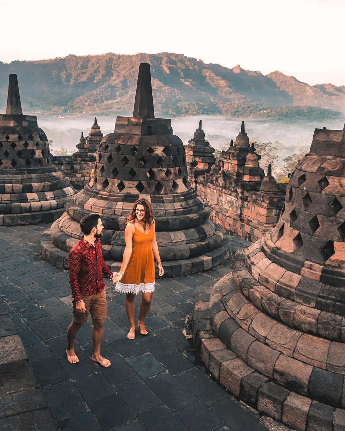Borobudur Temple, couple holding hands, barefoot, HD Phone Wallpaper
