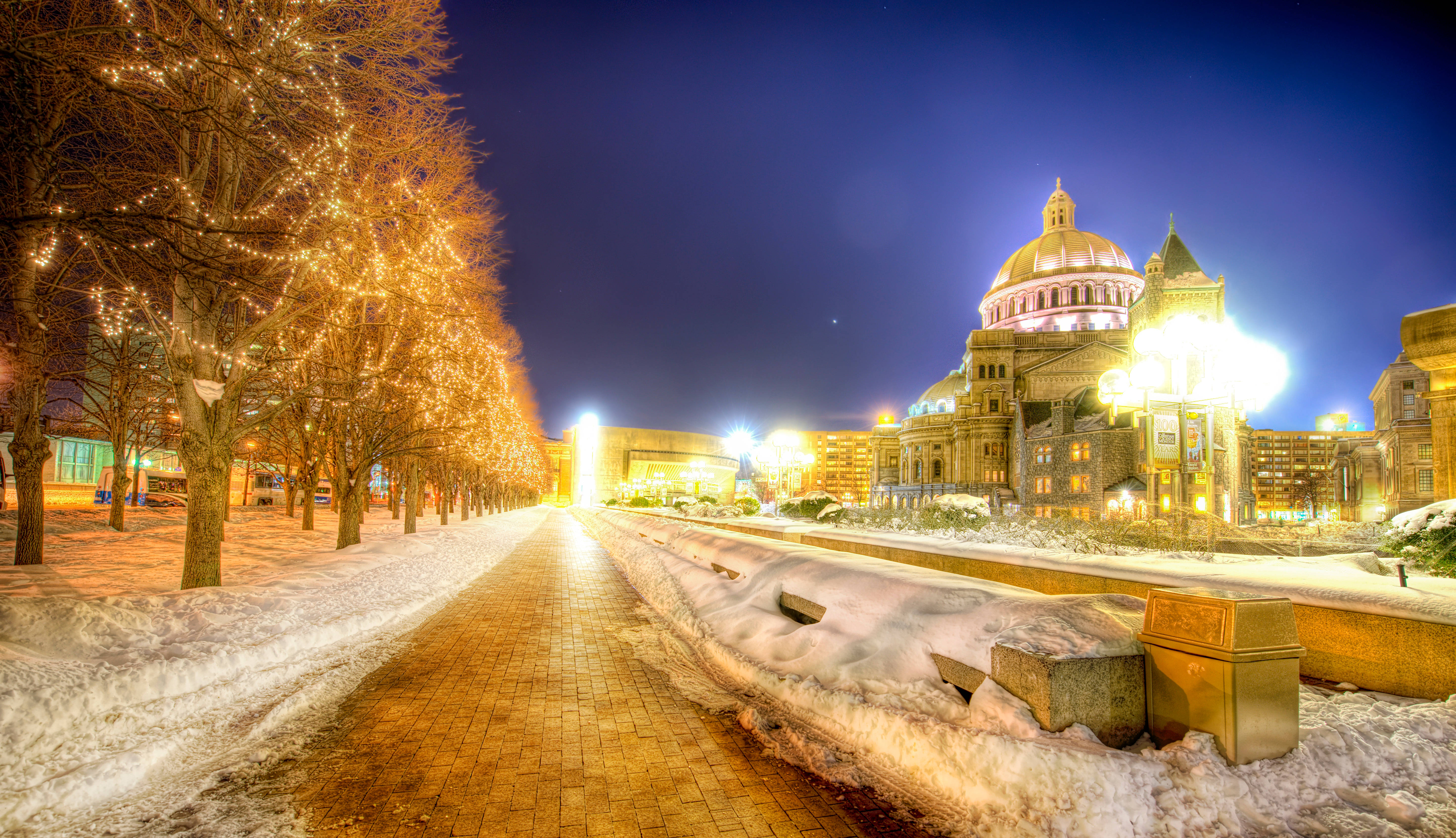 Boston, snow-covered city street, glowing string lights, 5K Desktop Wallpaper