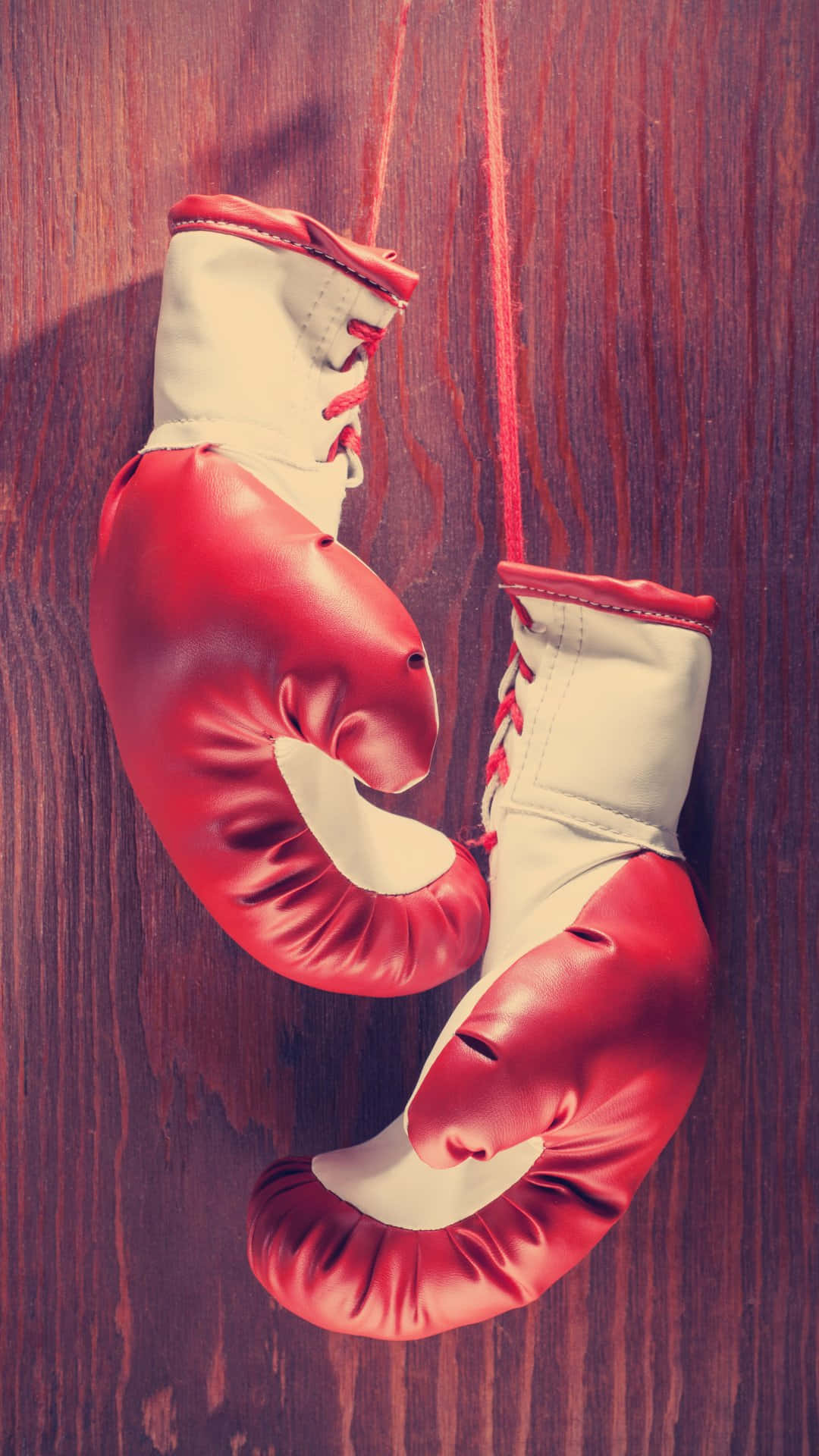 vintage red boxing gloves, red laces, dark wood background, Full HD Phone Wallpaper