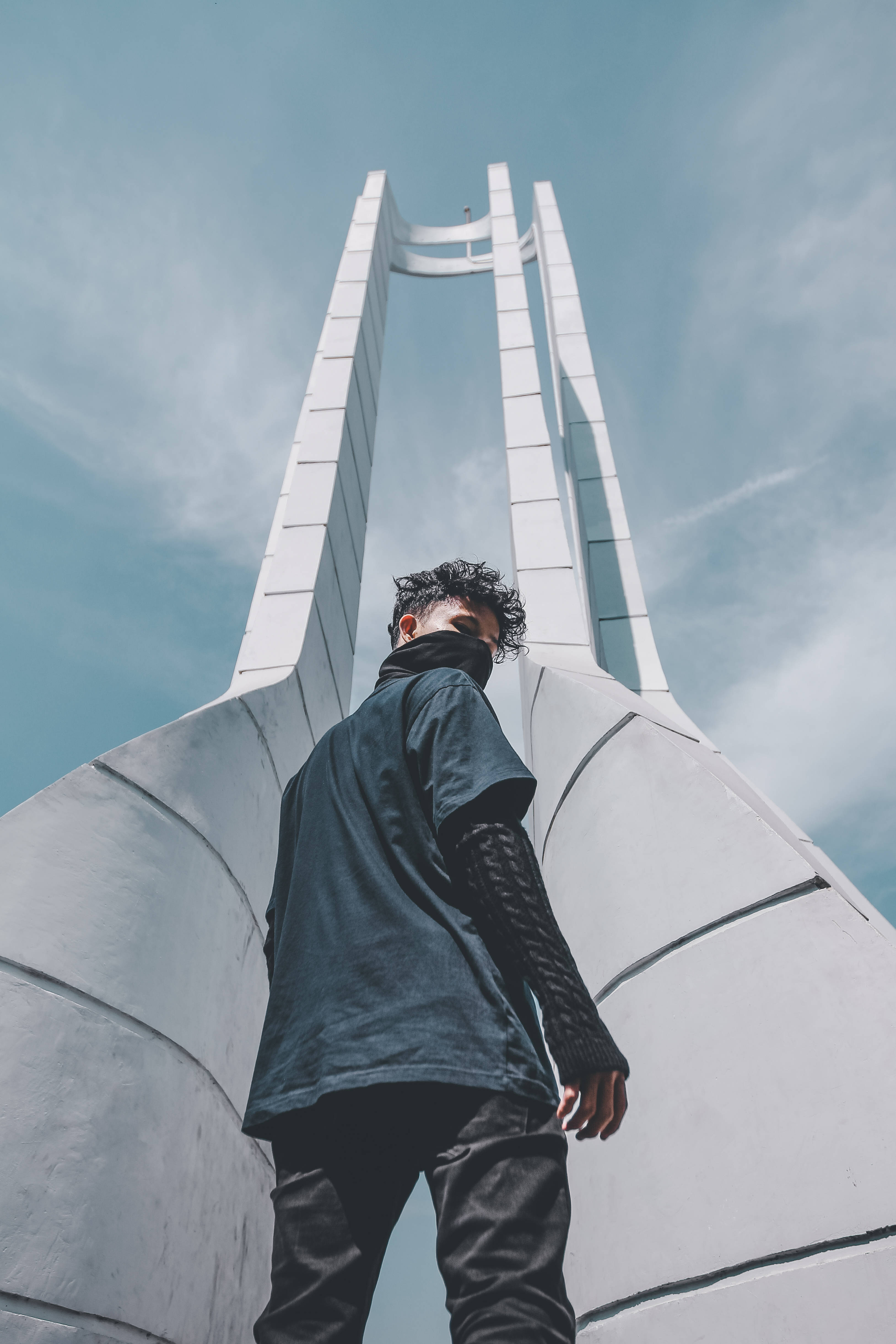 black outfit, young man, white modern architectural structure, 4K Phone Wallpaper