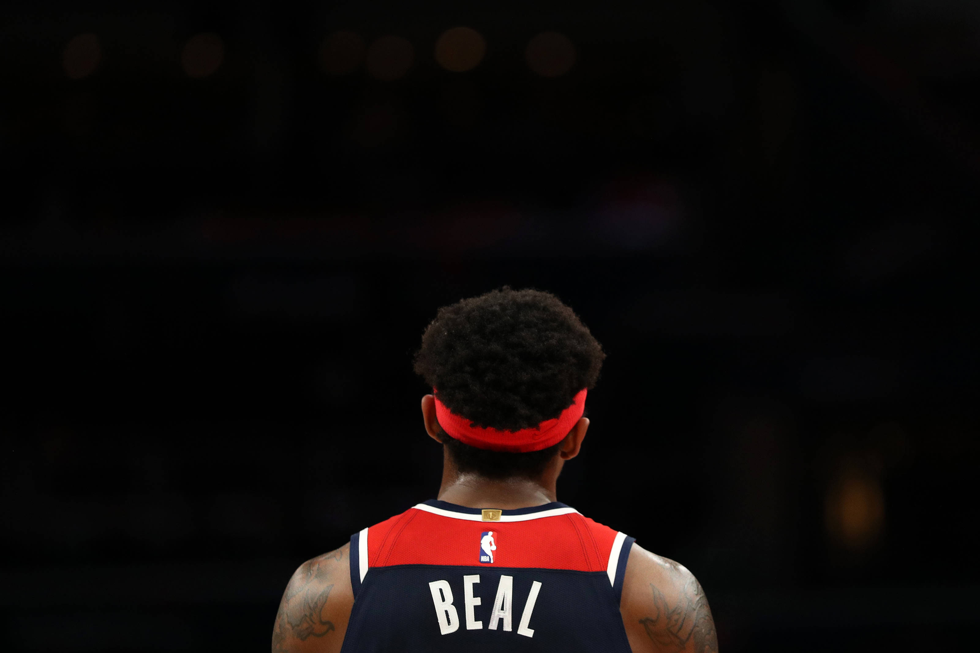 Bradley Beal, red and navy jersey, dim arena spotlight, 2K Desktop Wallpaper