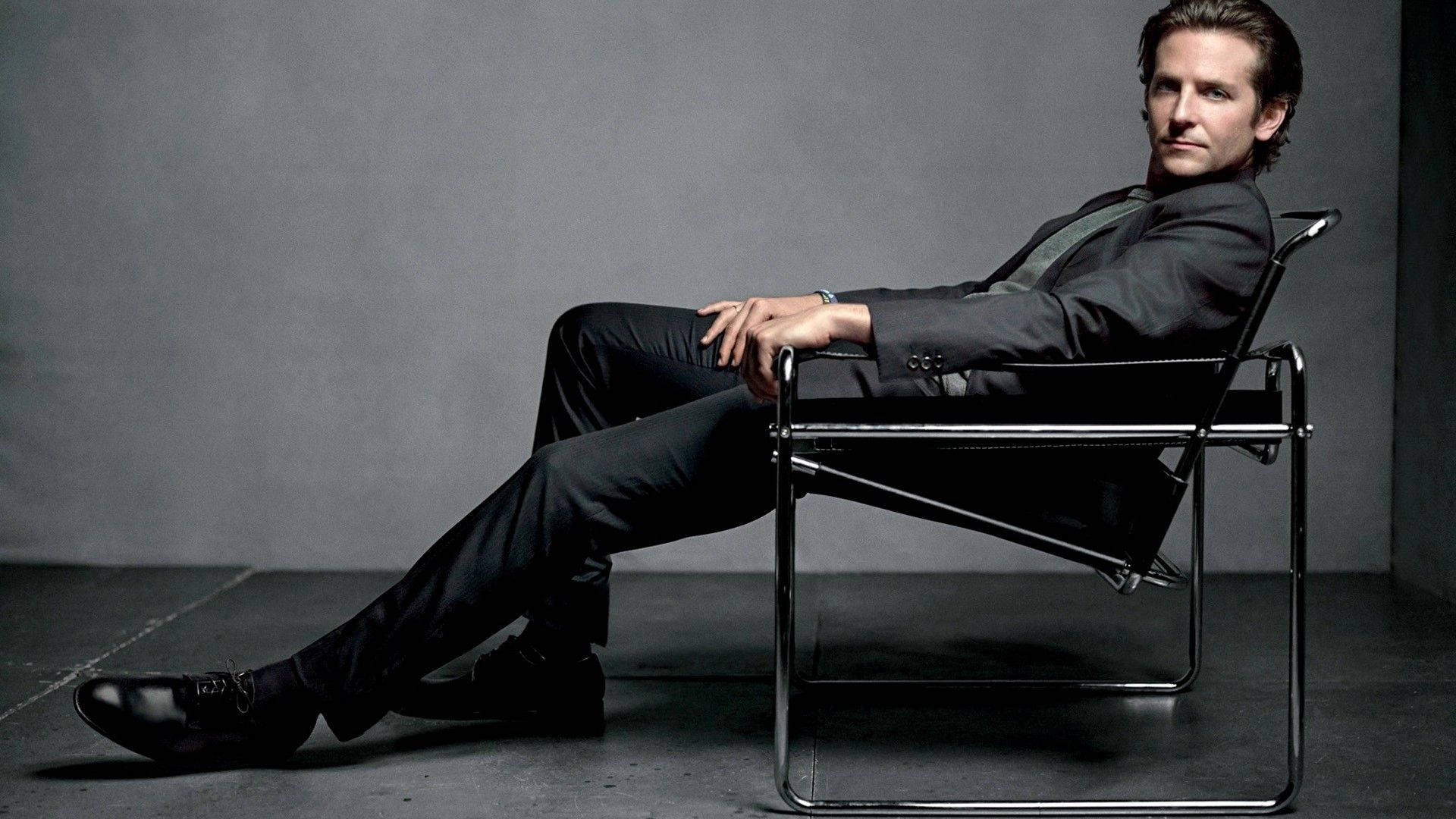 Bradley Cooper, black suit, modern metal chair, Full HD Desktop Wallpaper