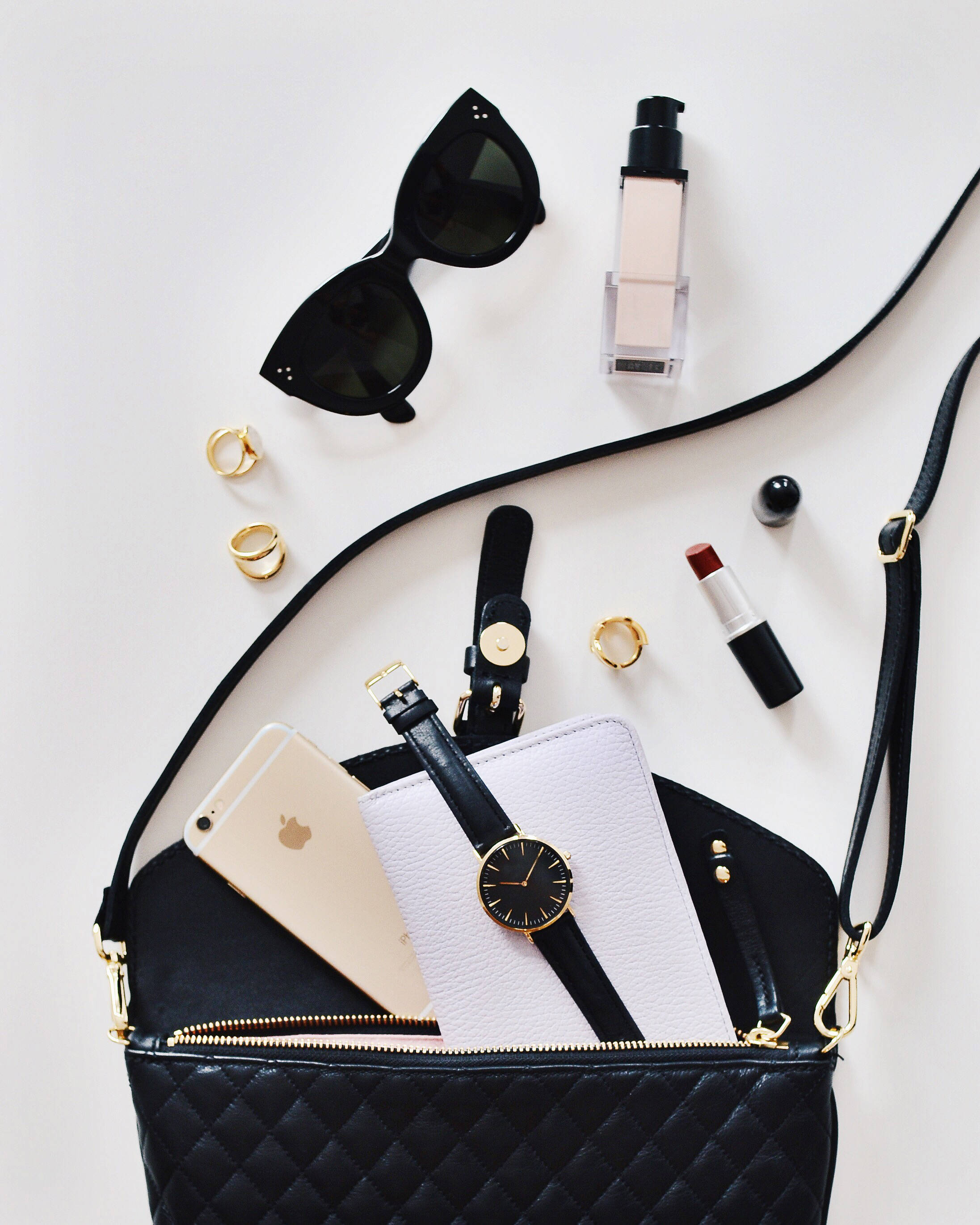 black quilted handbag, phone watch wallet, white surface, 2K Phone Wallpaper