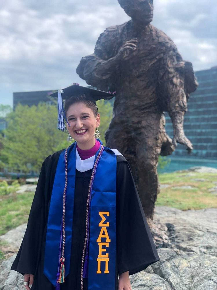 Brandeis University, black cap and gown, blue Sigma Alpha Pi sash, SD Phone Wallpaper