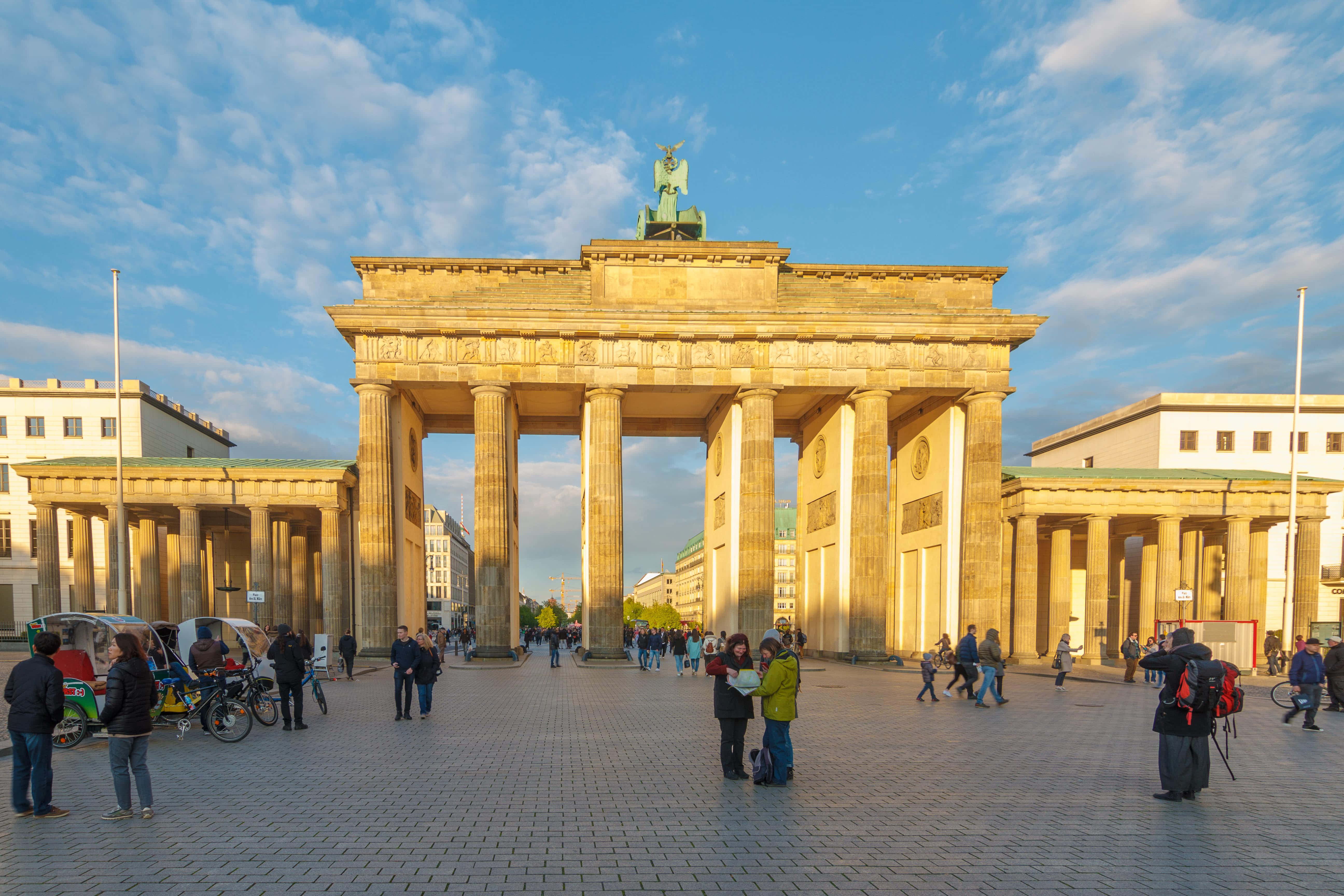 Brandenburg Gate, golden sunset light, cobblestone plaza, 5K Desktop Wallpaper