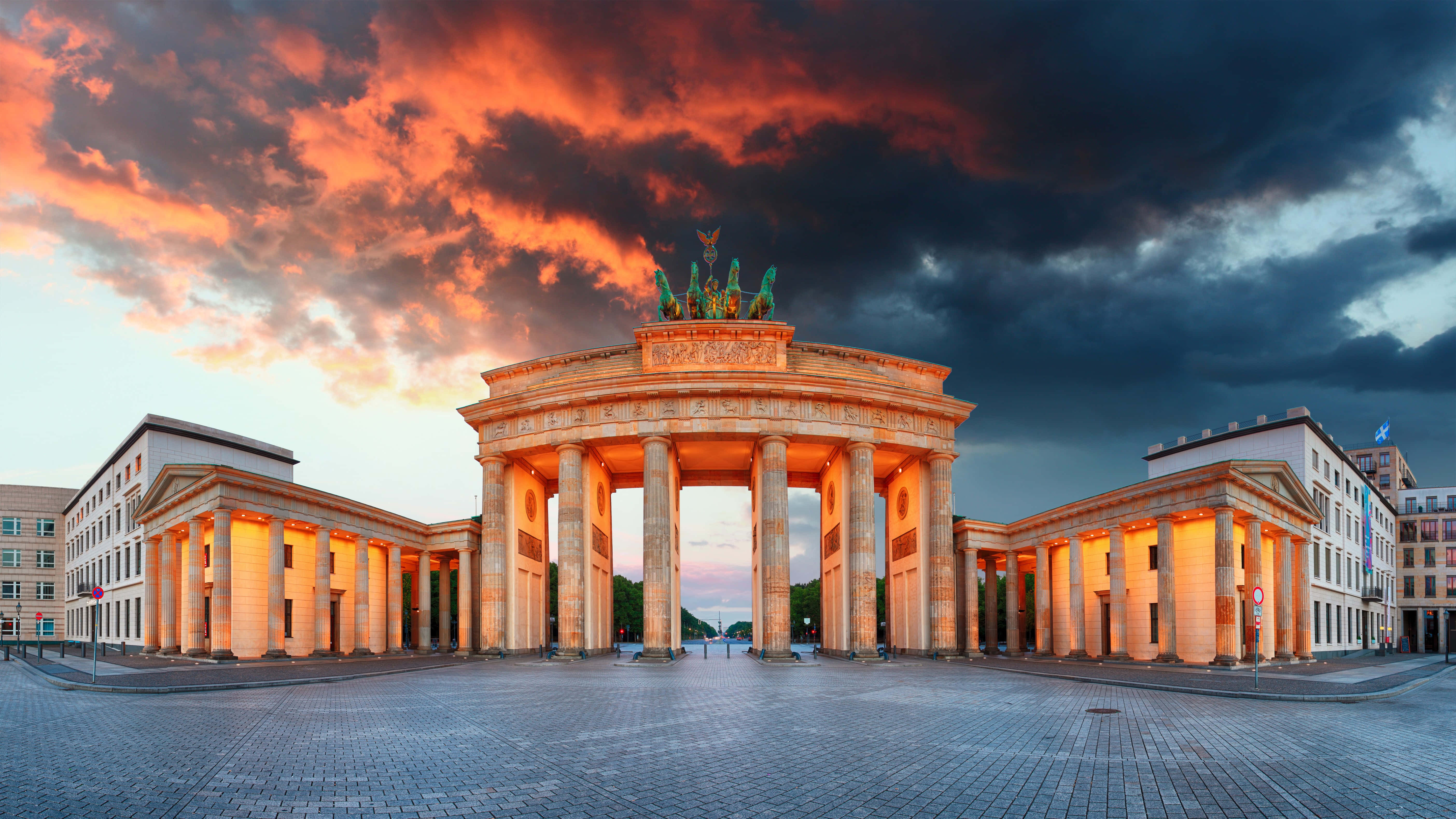 Brandenburg Gate, golden sunset light, fiery orange sky, 5K Desktop Wallpaper