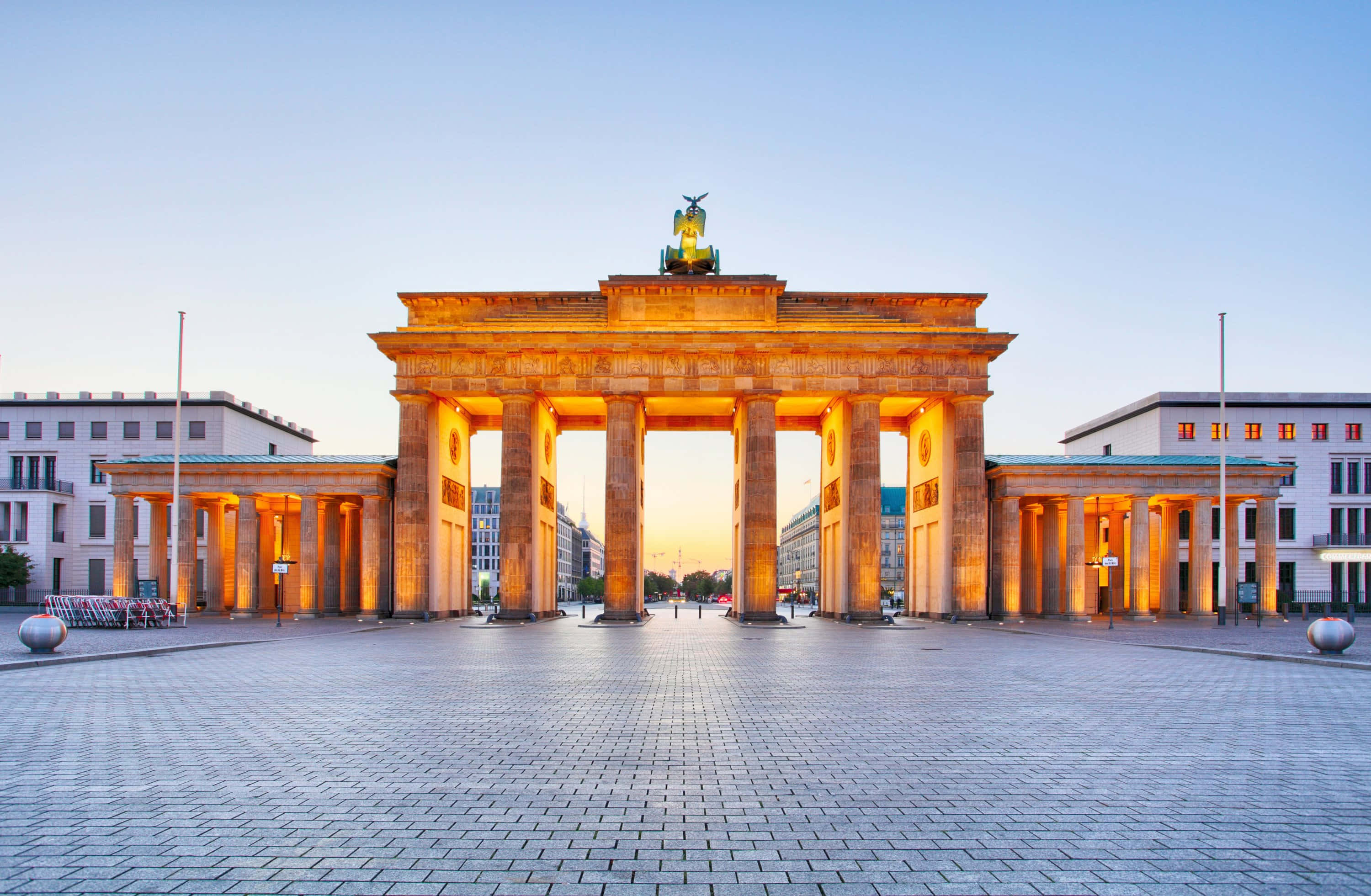 Brandenburg Gate, golden sunset light, clear blue sky, 2K Desktop Wallpaper