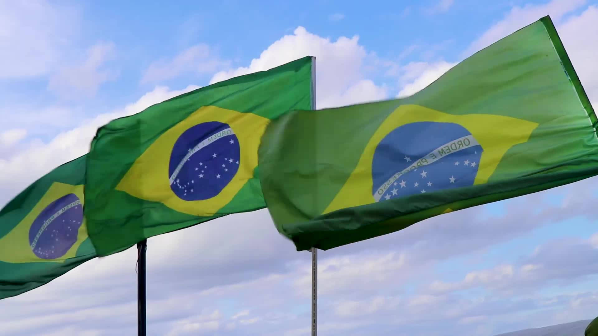 Brazil flag, bright blue sky, scattered white clouds, Full HD Desktop Wallpaper