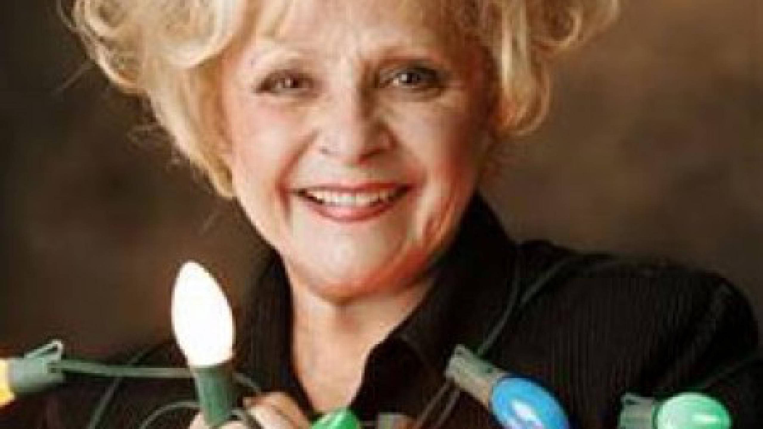 Brenda Lee, curly blonde hair, colorful string lights, 2K Desktop Wallpaper