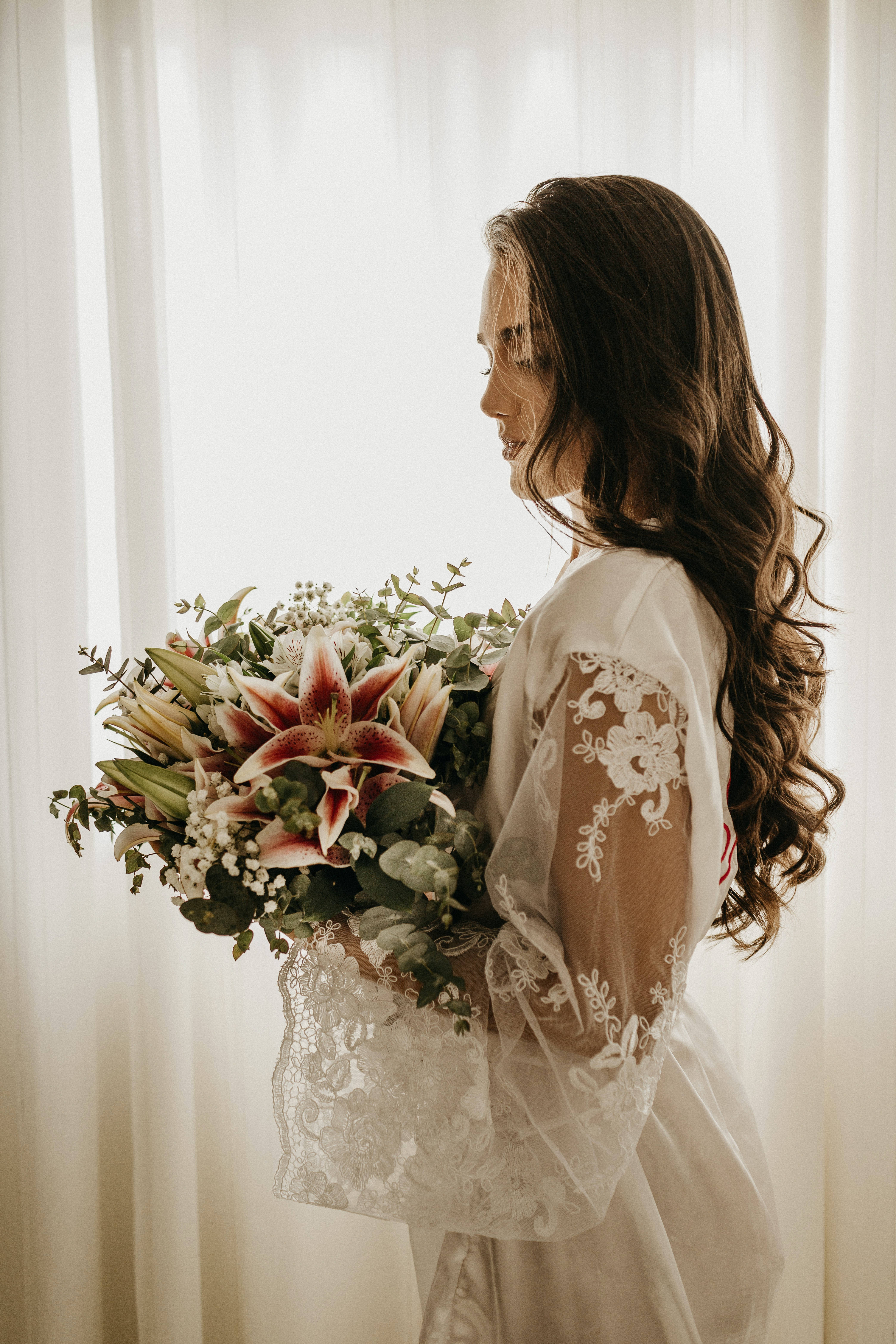 bride, lace gown, vibrant bouquet of lilies and greenery, 5K Phone Wallpaper