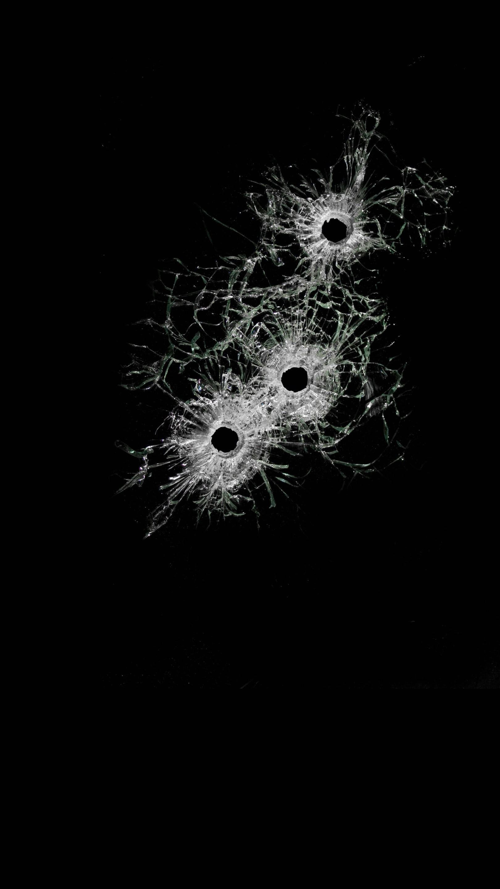 bullet holes, broken glass, stark black background, 2K Phone Wallpaper