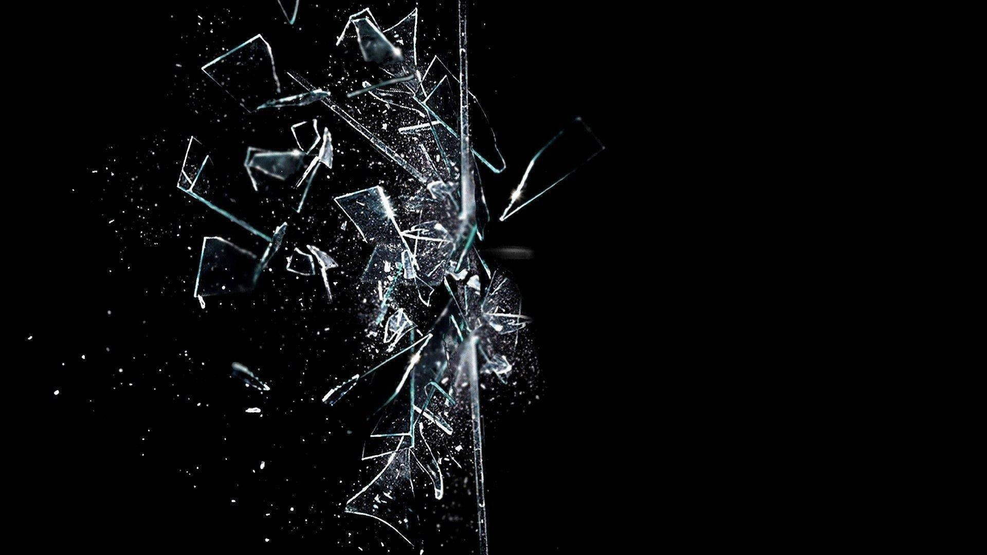 cracked computer screen glass, shattered glass fragments, pure black background, Full HD Desktop Wallpaper