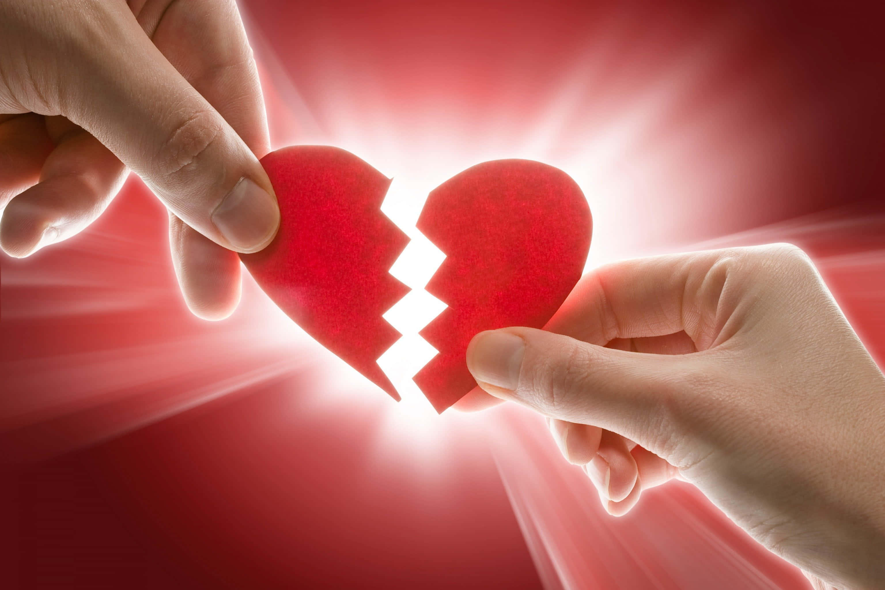 Broken Heart Symbolism, red paper heart, radiant red background, 2K Desktop Wallpaper