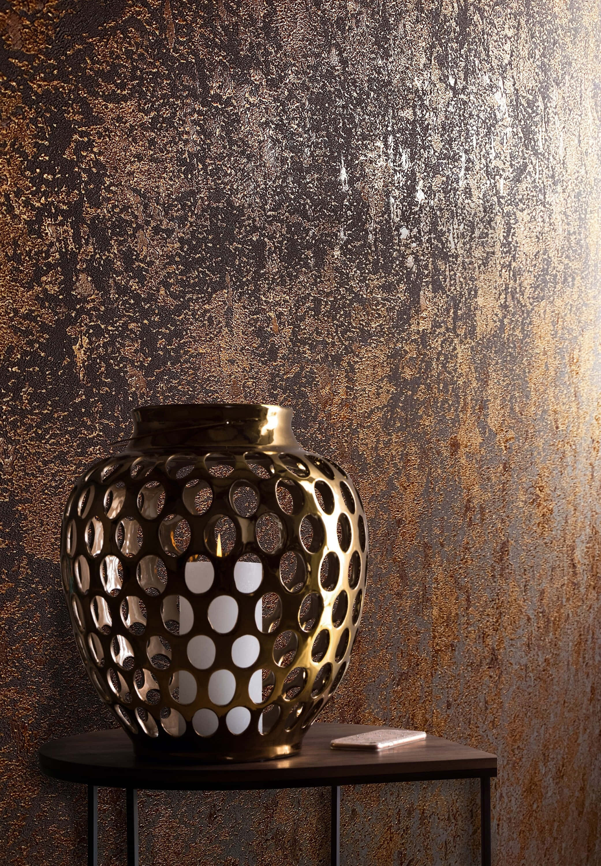golden perforated vase, dark table, textured metallic wall, 2K Phone Wallpaper