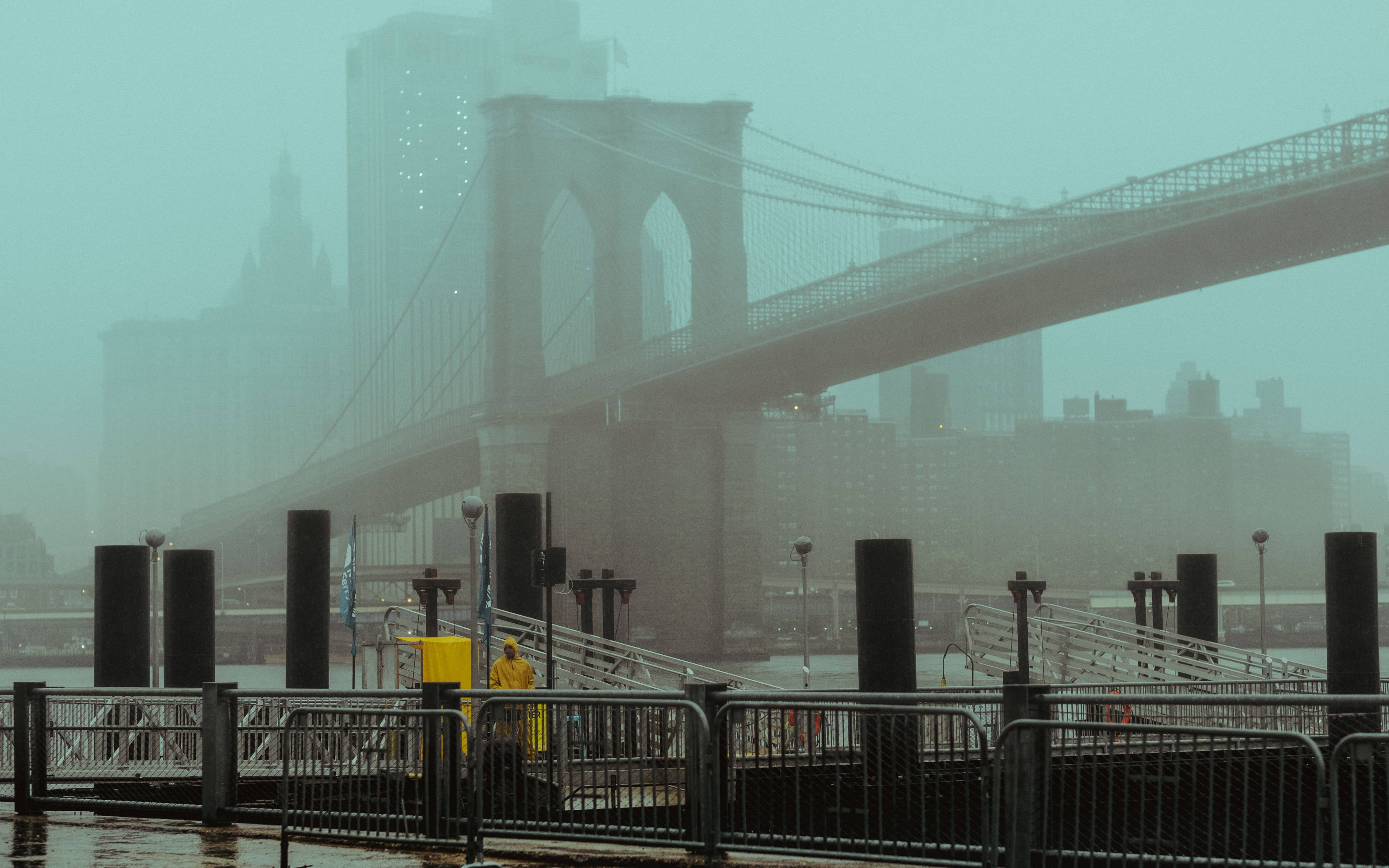 Brooklyn Bridge, yellow raincoat, foggy waterfront pier, 2K Desktop Wallpaper