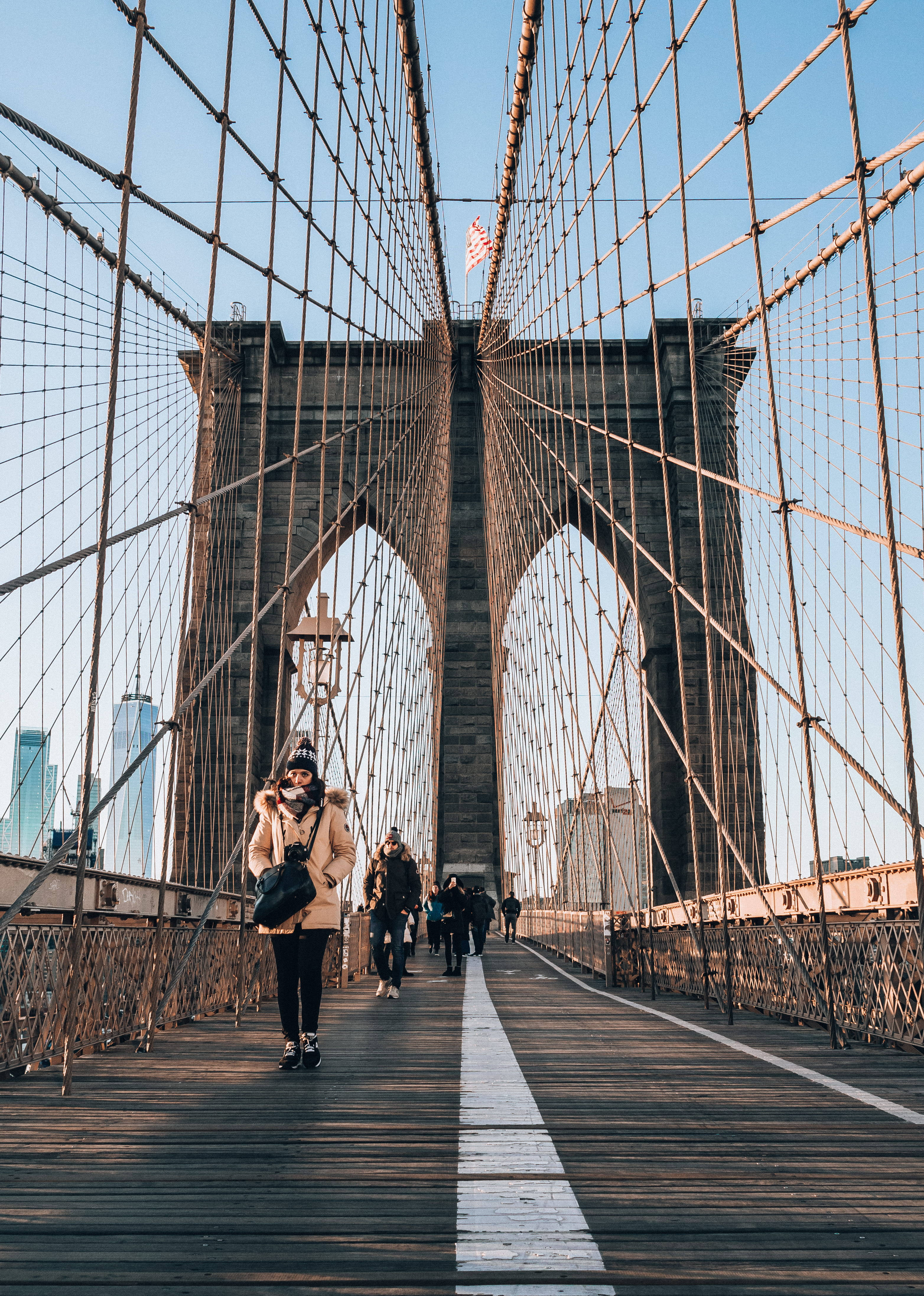 Brooklyn Bridge, beige coat, wooden pedestrian path, 4K Phone Wallpaper