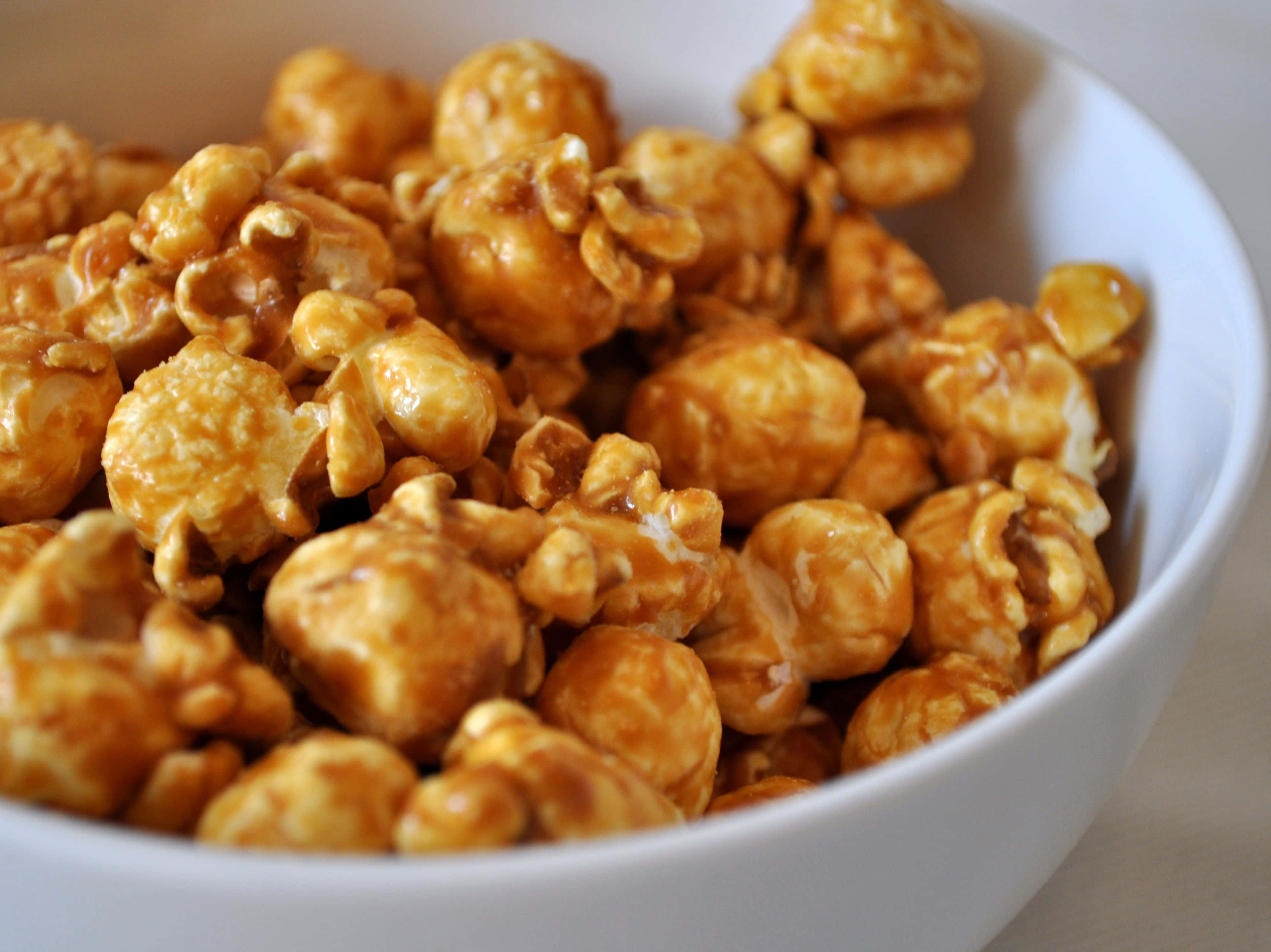 Brown Caramel, glossy caramel-coated popcorn, white bowl, 2K Desktop Wallpaper