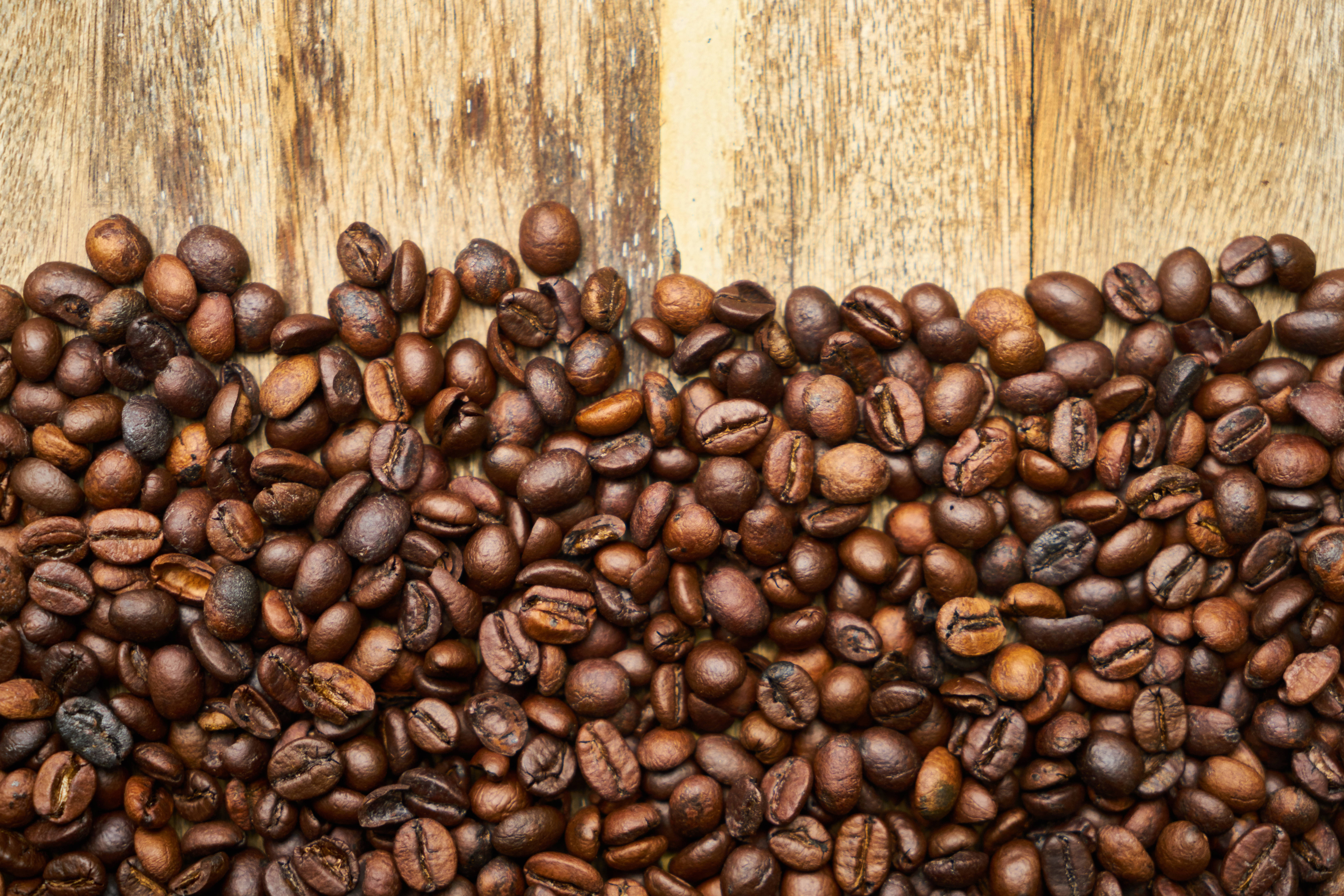 coffee beans, rustic weathered wooden surface, dark roasted, 5K Desktop Wallpaper