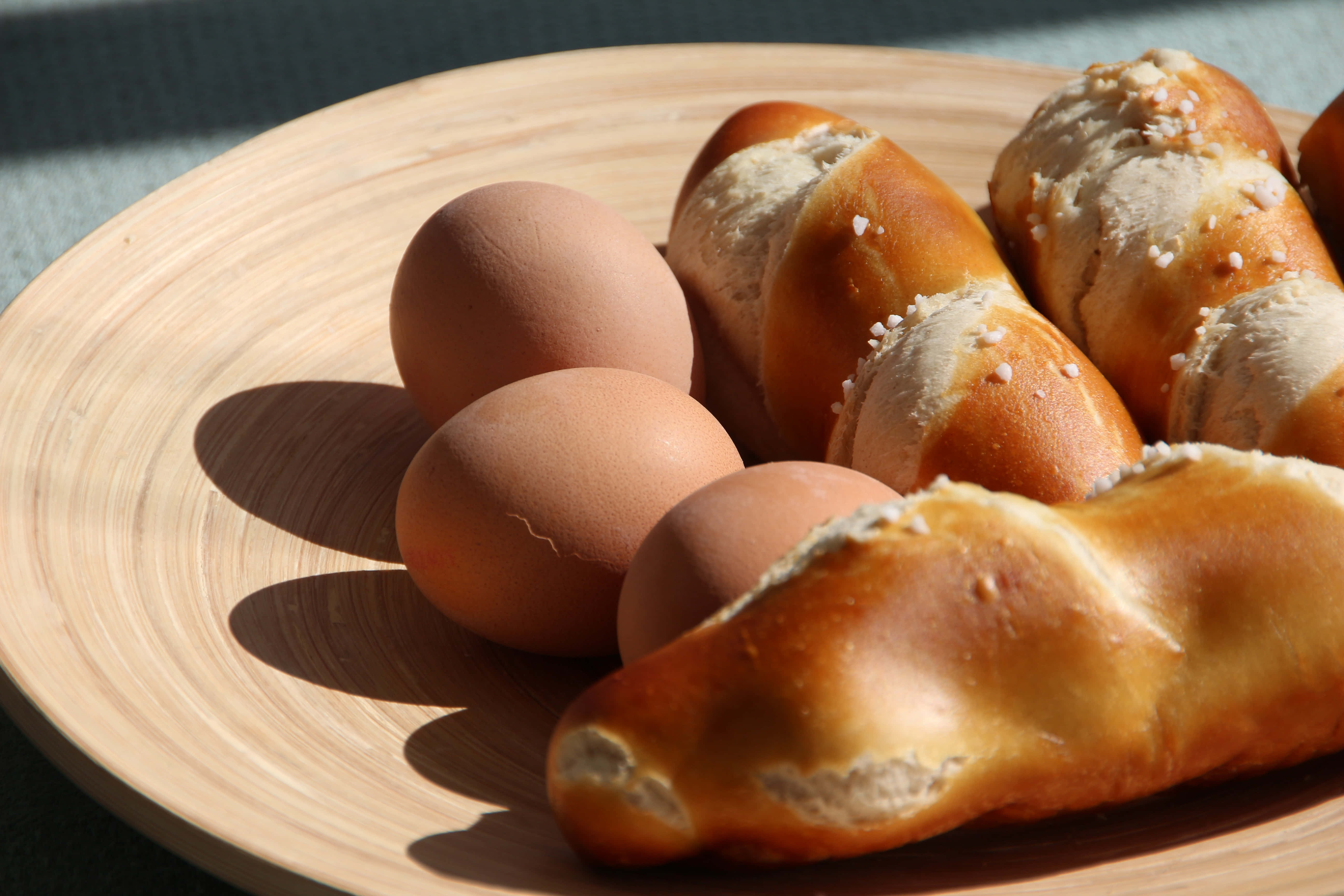 Brown Eggs, rustic wooden table, sunlit brown eggs, 5K Desktop Wallpaper