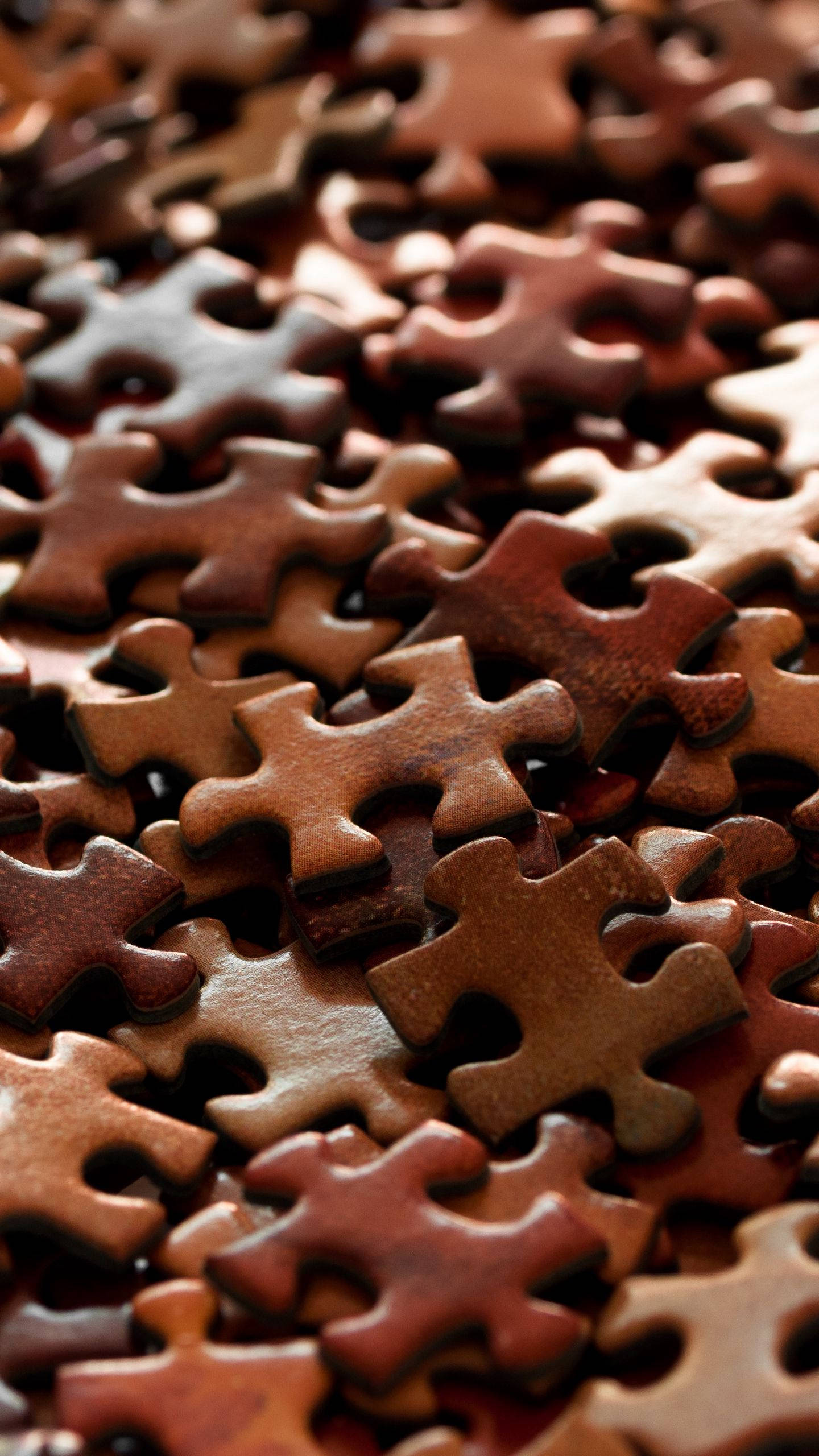 brown iPhone, wooden jigsaw puzzle pieces, rich brown tones, 2K Phone Wallpaper