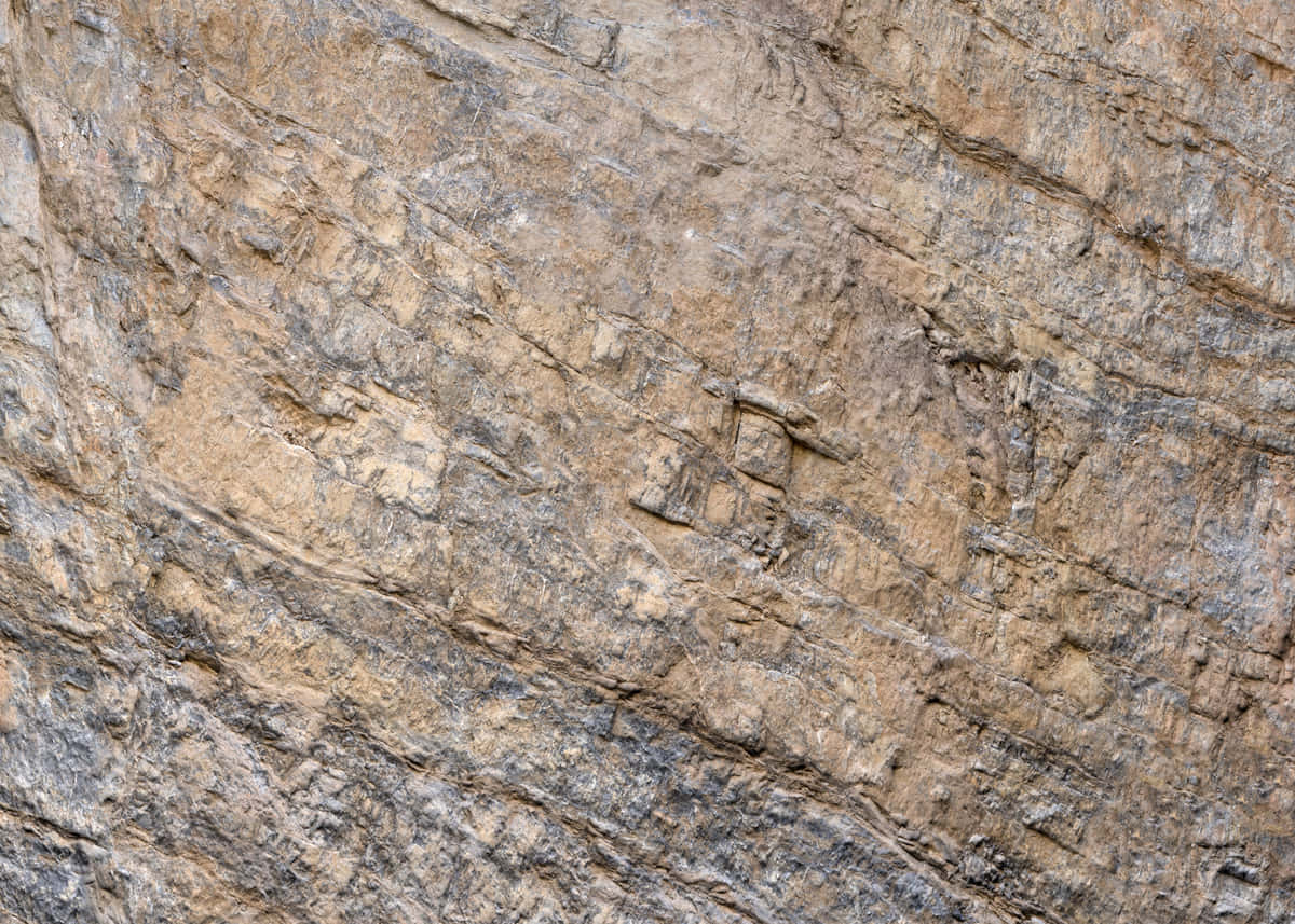brown stone, rugged layered rock face, earthy tones, SD Desktop Wallpaper