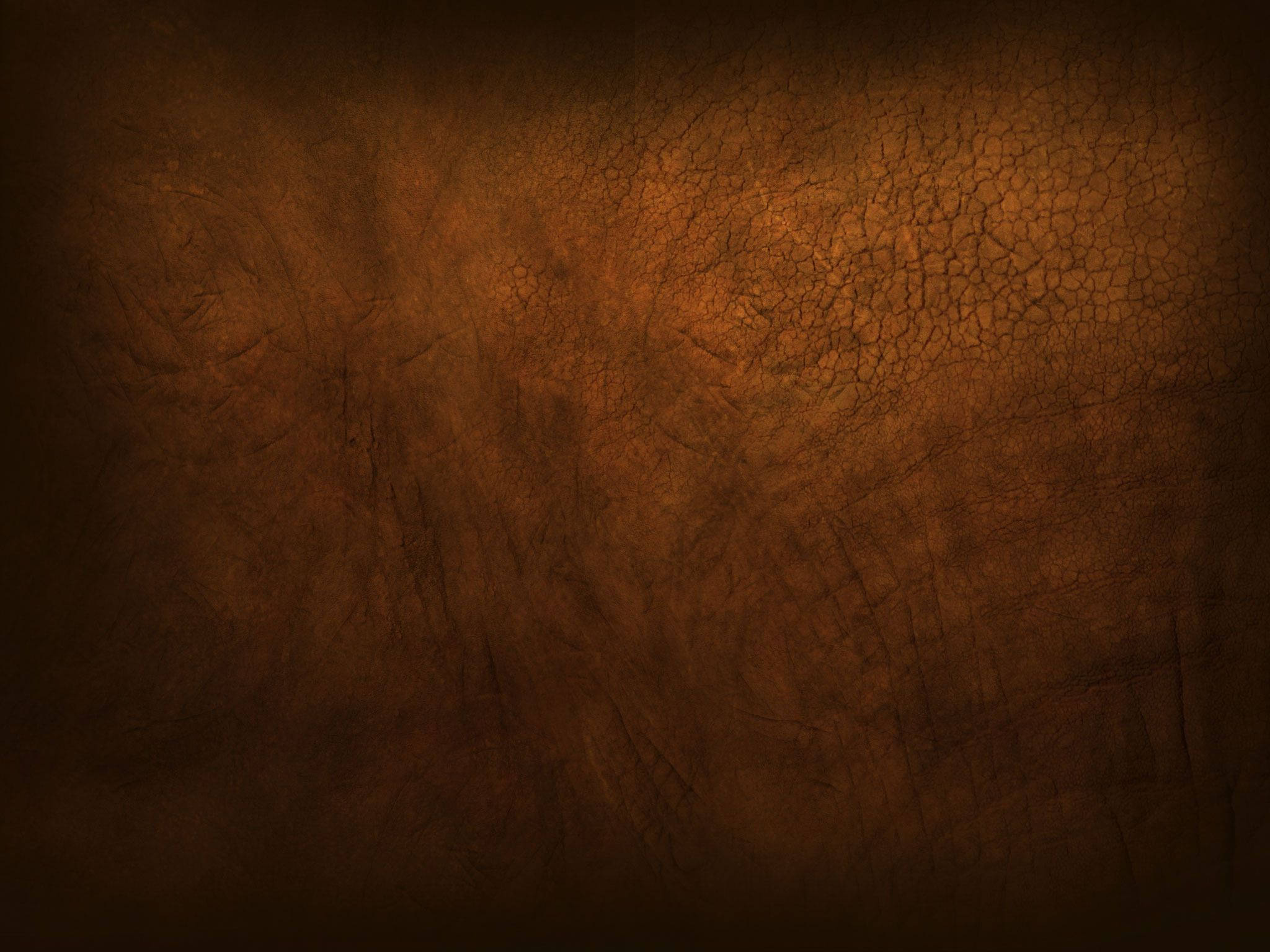 brown dry land texture, cracked brown leather texture, dark to warm amber tones, Full HD Desktop Wallpaper