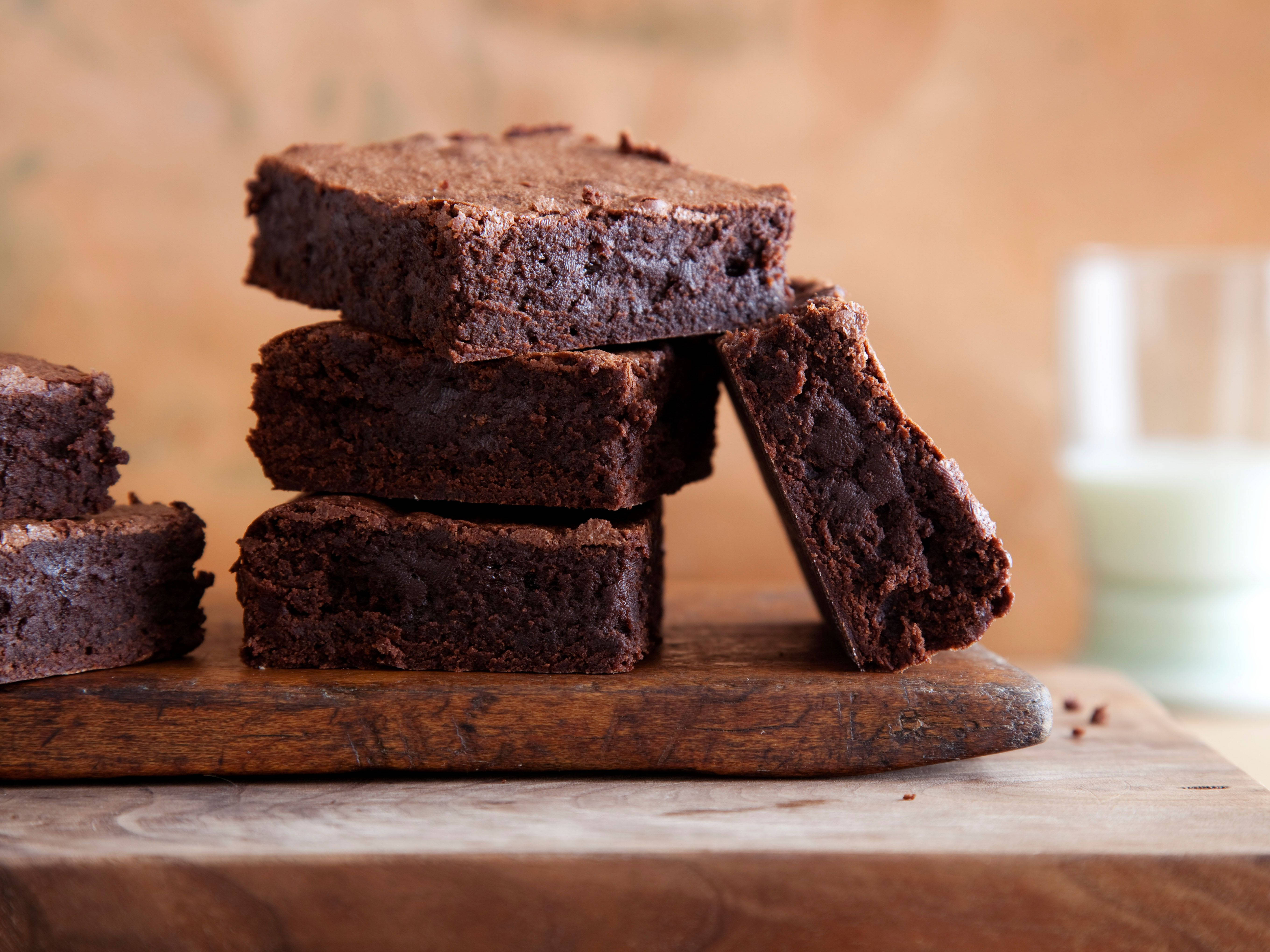fudgy chocolate brownies, rustic wooden board, glass of milk, 5K Desktop Wallpaper