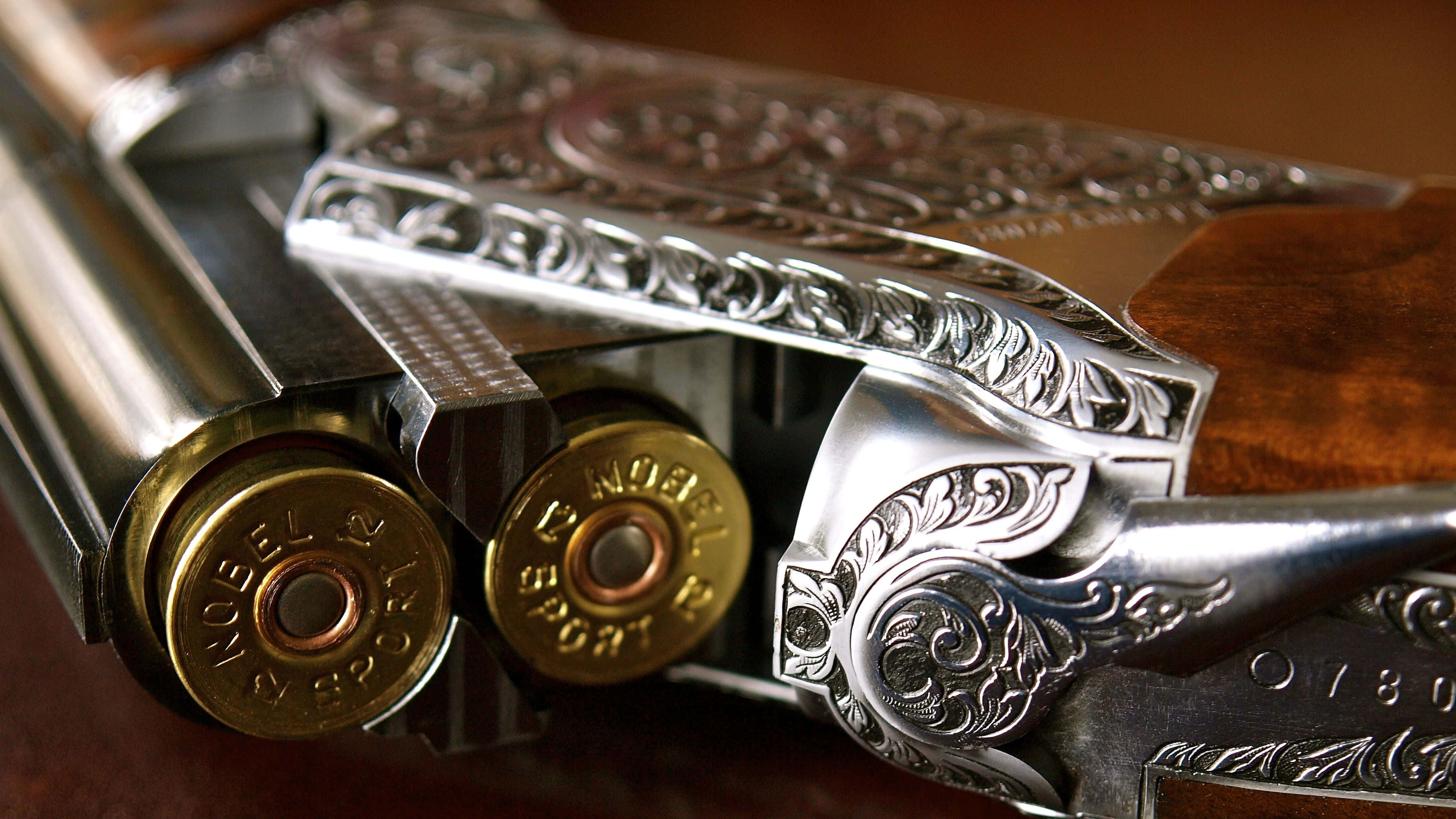 Browning Desktop, silver engraved shotgun, brass shells, 2K Desktop Wallpaper