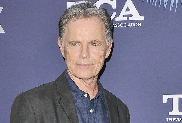 Bruce Greenwood, blue event backdrop, white logos, SD Desktop Wallpaper