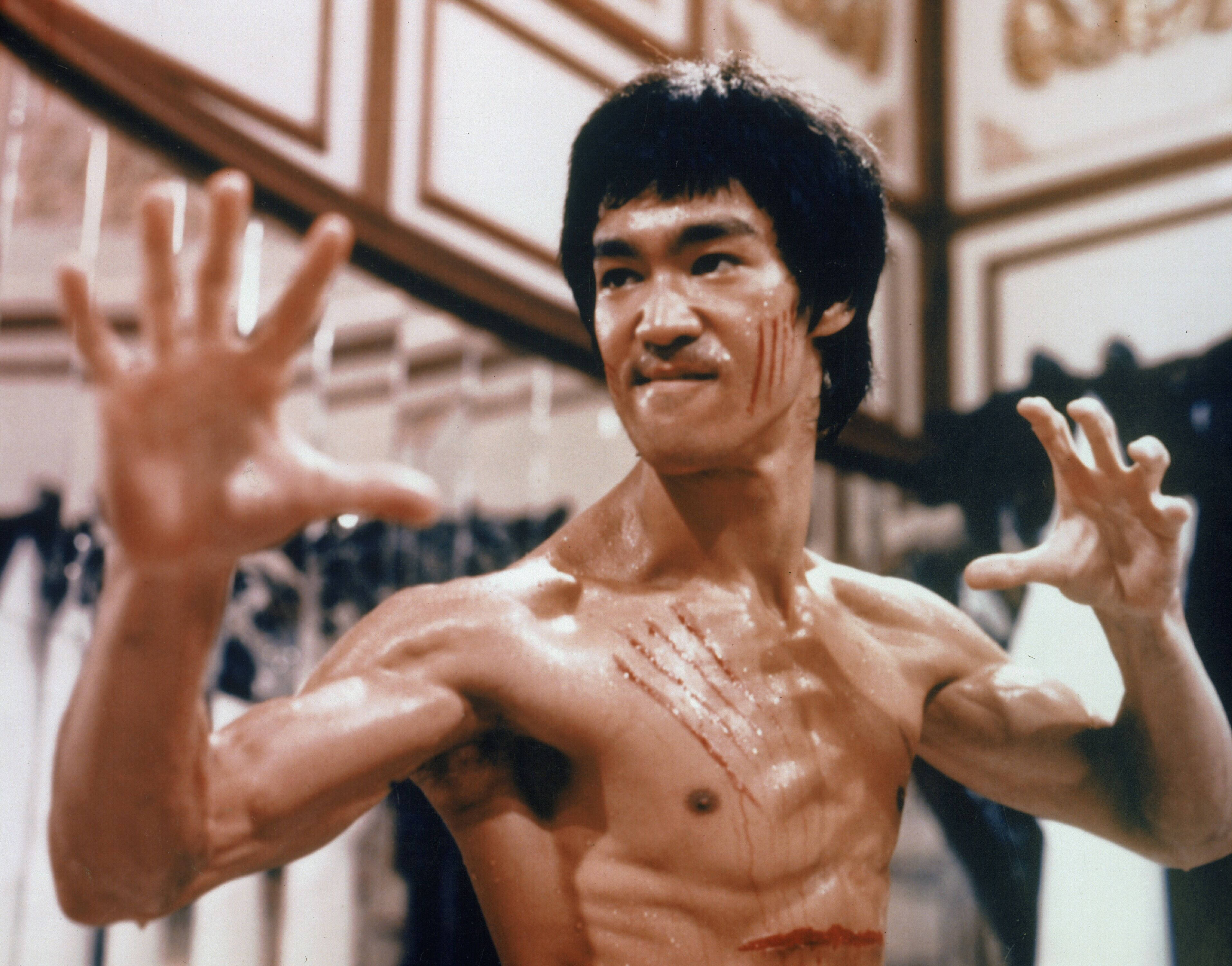Bruce Lee, gritty martial arts scene, blood on his face and chest, 2K Desktop Wallpaper