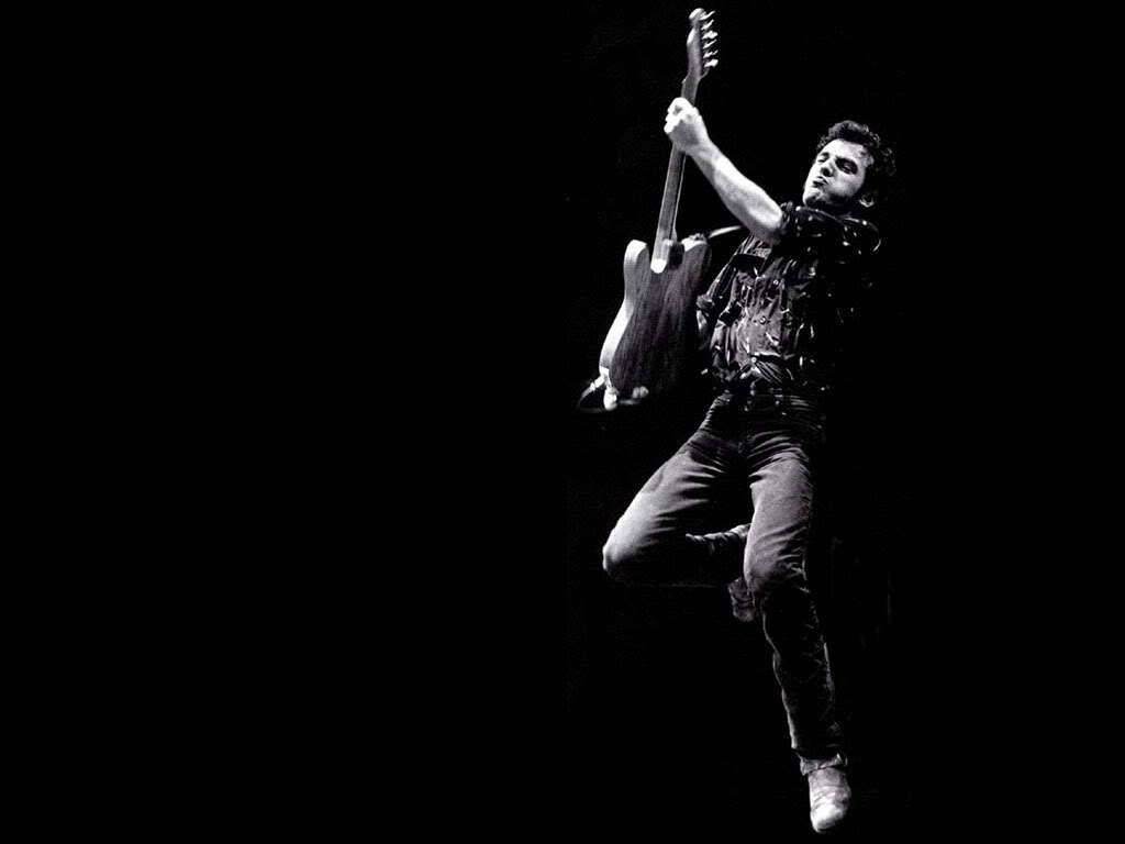 Bruce Springsteen, electric guitar, stark black background, SD Desktop Wallpaper