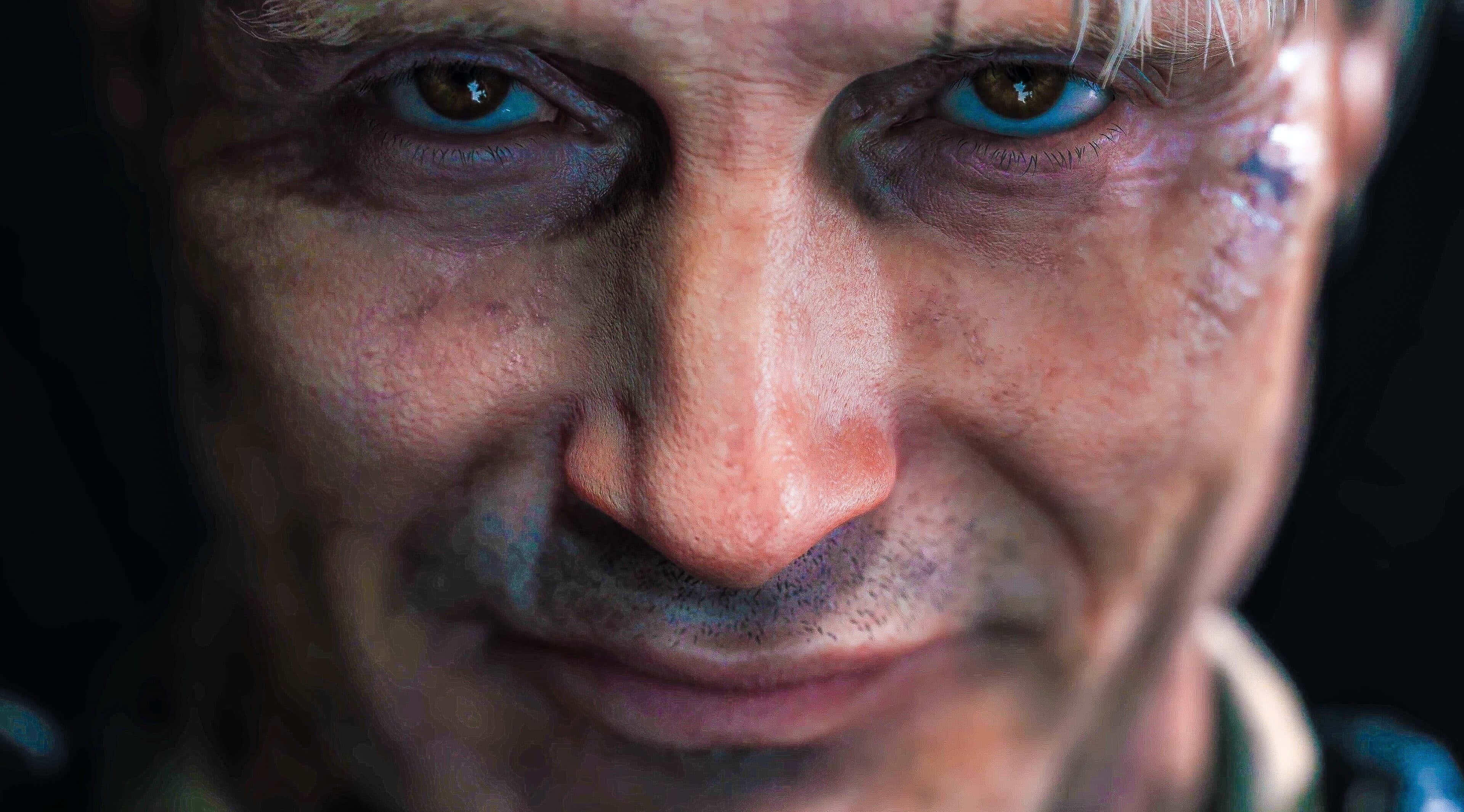 bruised man, intense blue eyes, dirt smudges, 4K Desktop Wallpaper