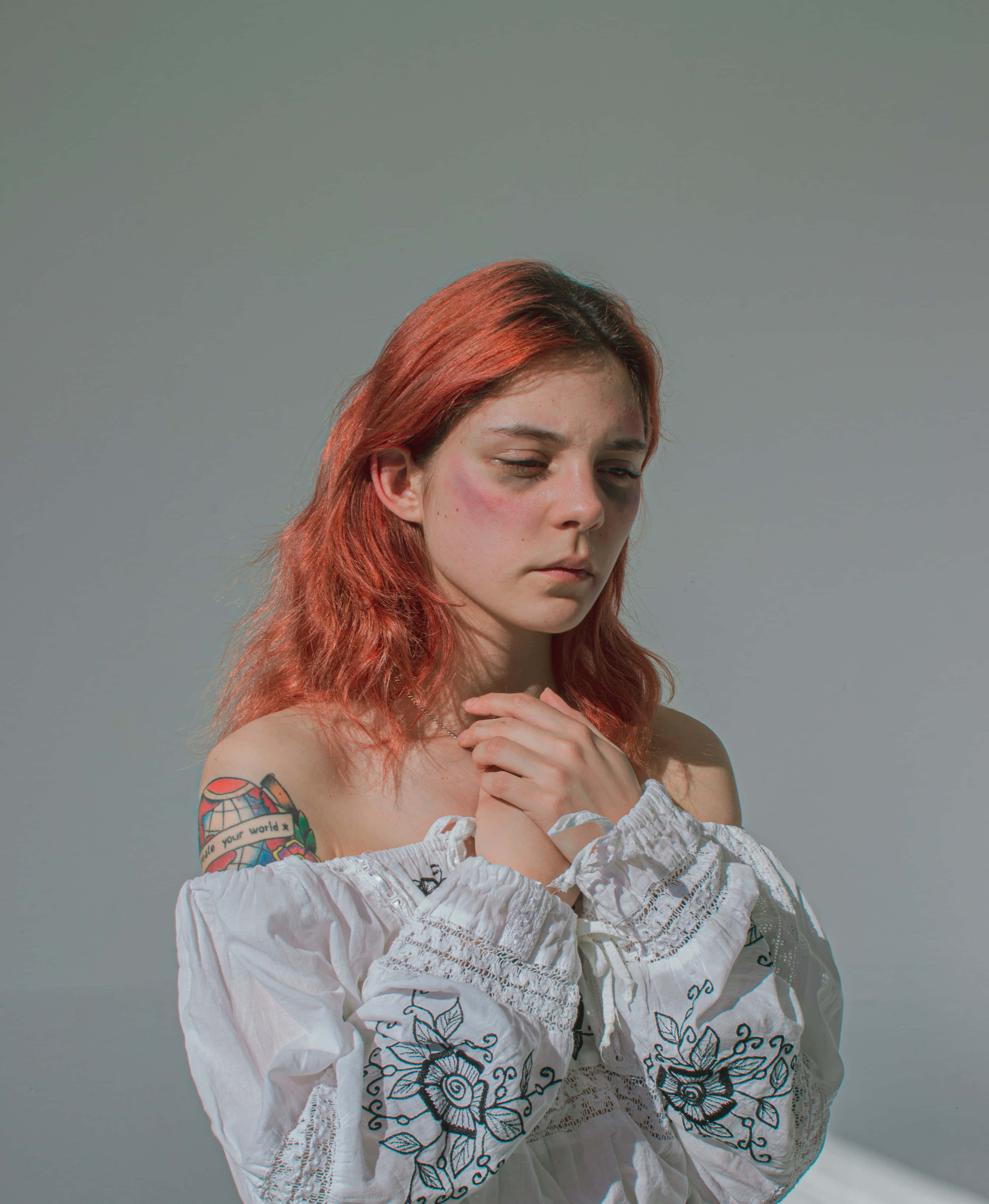 bruised redhead girl, vibrant red hair, tattooed shoulder, 4K Phone Wallpaper